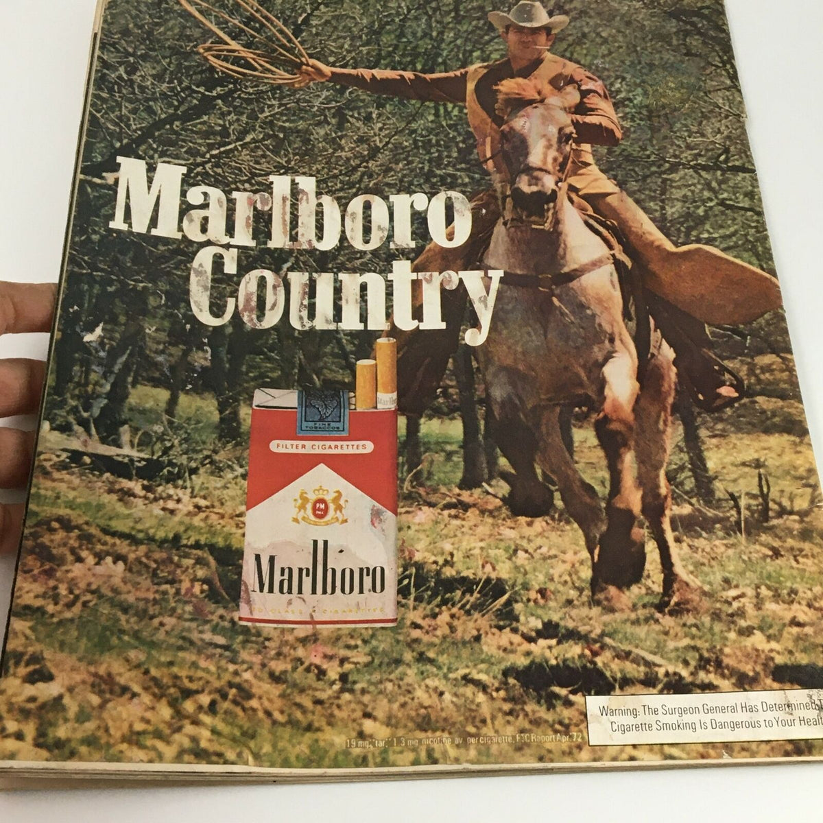 Inside page of VTG Life Magazine August 11 1972, showcasing a classic Marlboro advertisement with a cowboy on horseback in a natural setting.