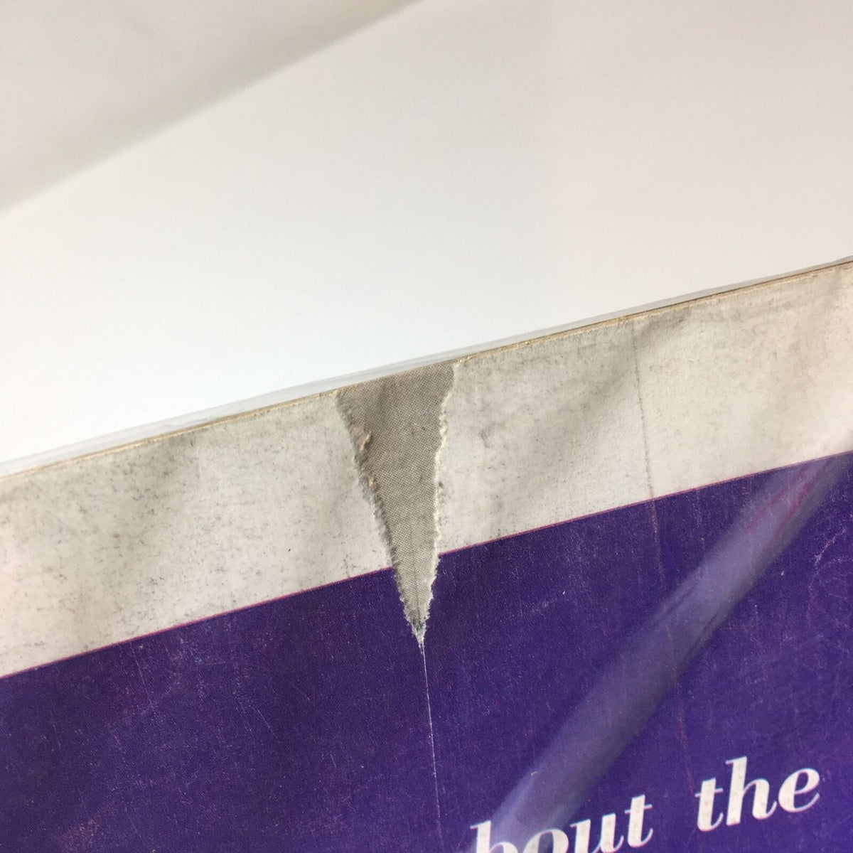 Close-up view of the edge of the Vintage Life Magazine from December 29, 1952, showing a rip and wear consistent with age, highlighting its vintage charm and character.