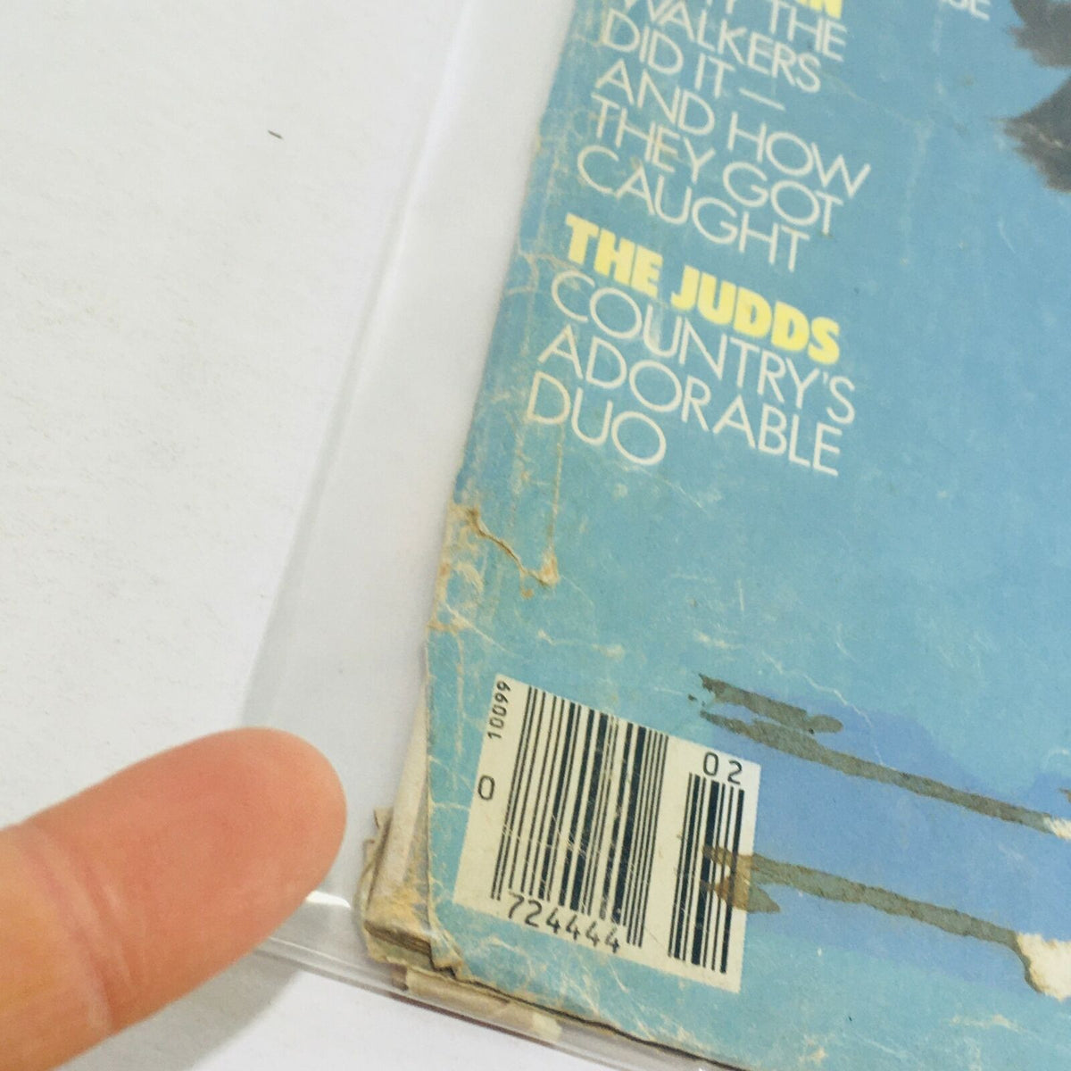 Back cover detail of VTG Life Magazine February 1986 highlighting articles about the Judds and the 'Spy Clan', featuring wear and a barcode.