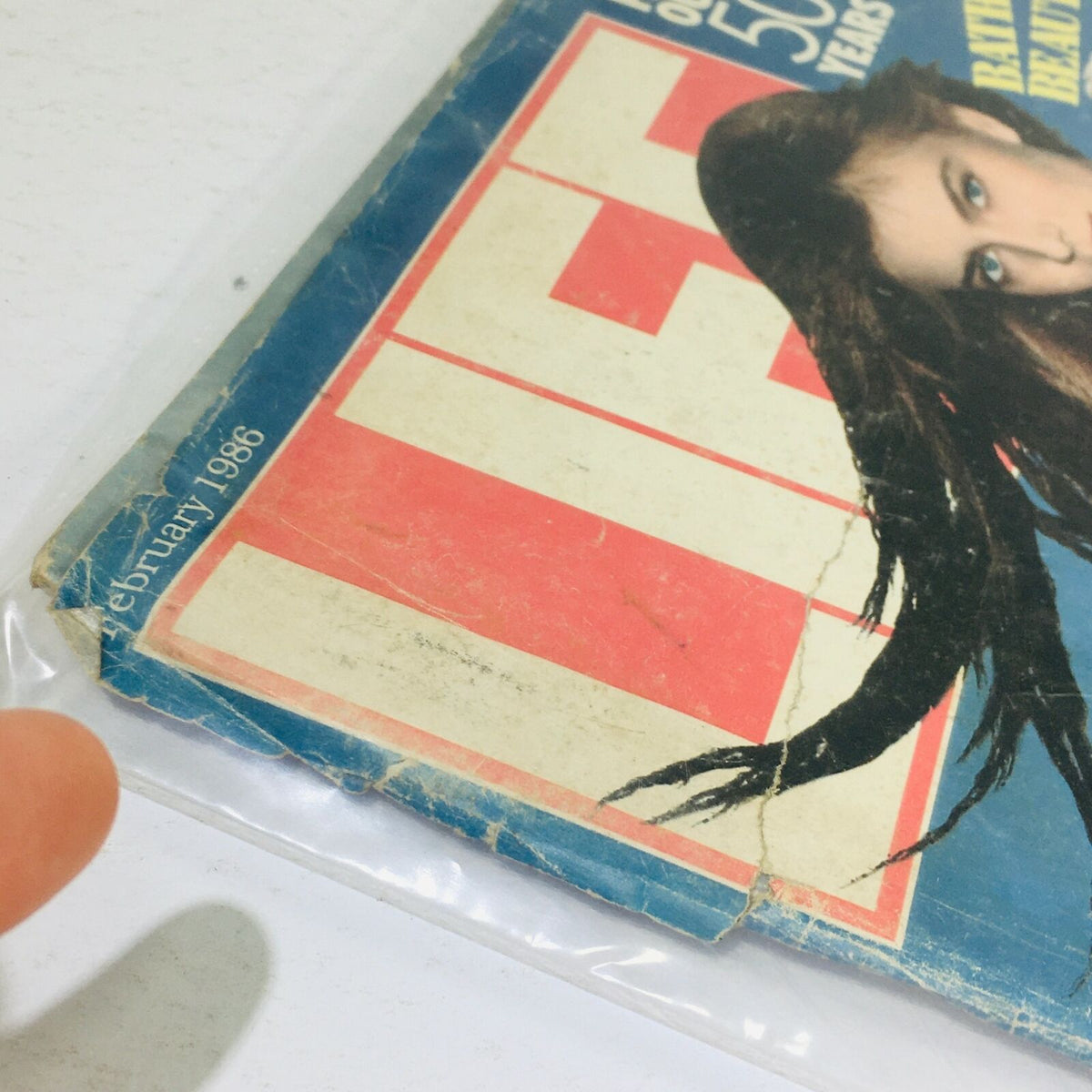 Detailed look at the corner of the VTG Life Magazine February 1986 issue, illustrating the cover with Paulina Porizkova, including visible wear and the date of February 1986, highlighting its collector's status.