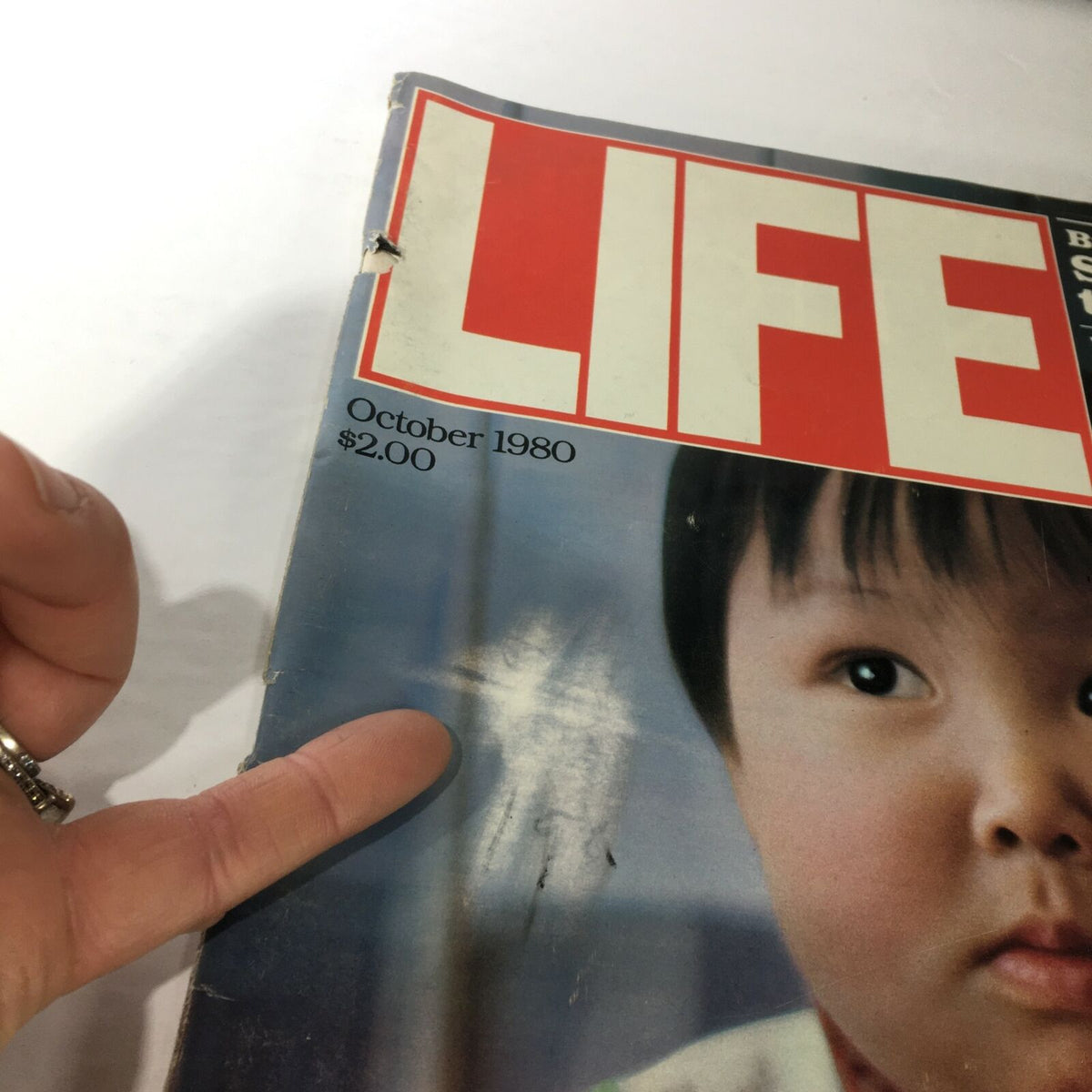 Close-up view of the cover of VTG Life Magazine: October 1980, highlighting the title 'Showdown for Presidency' and imperfections on the magazine's surface.