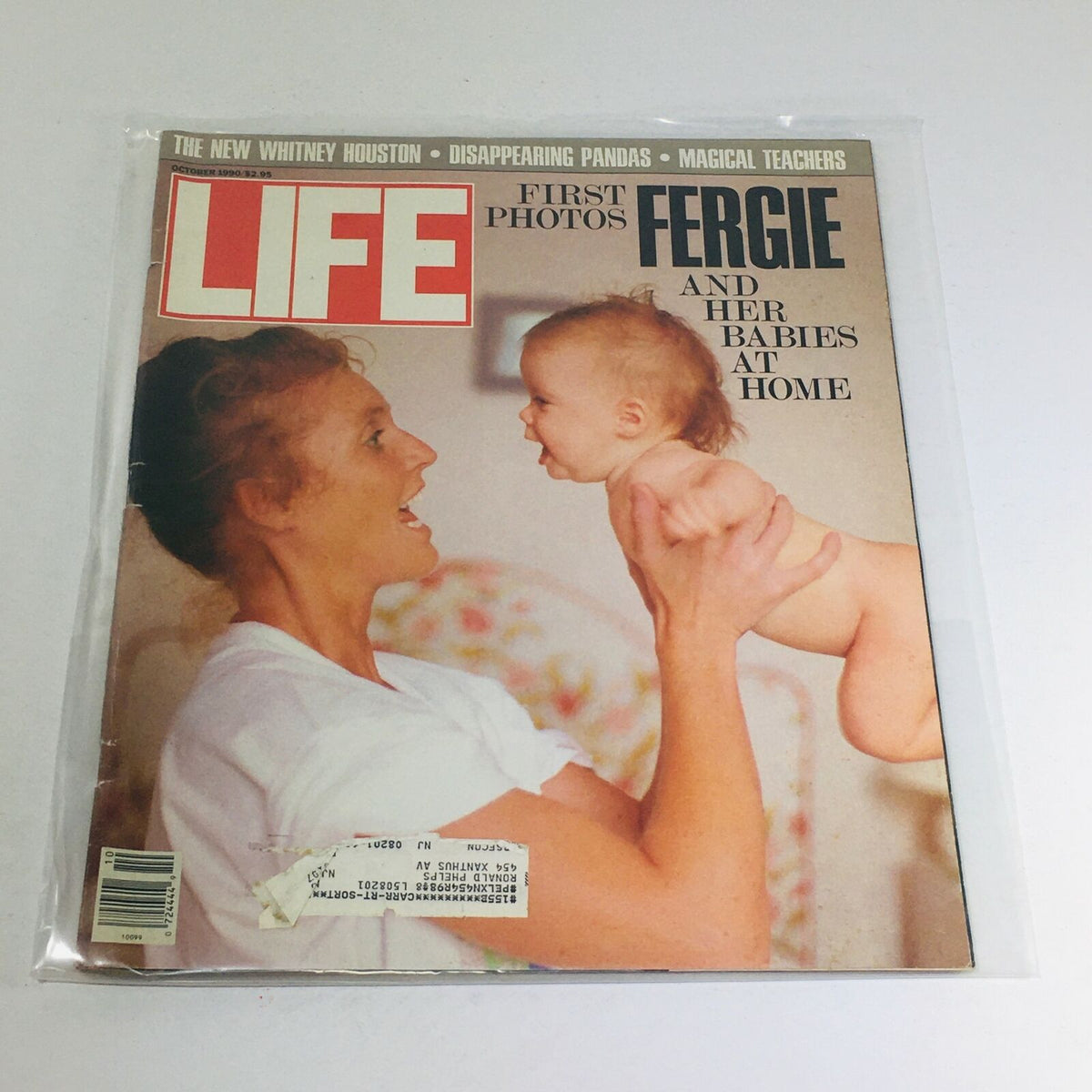 VTG Life Magazine cover from October 1990 featuring Fergie joyfully holding her baby, showcasing the first-ever photos of Fergie and her children at home.