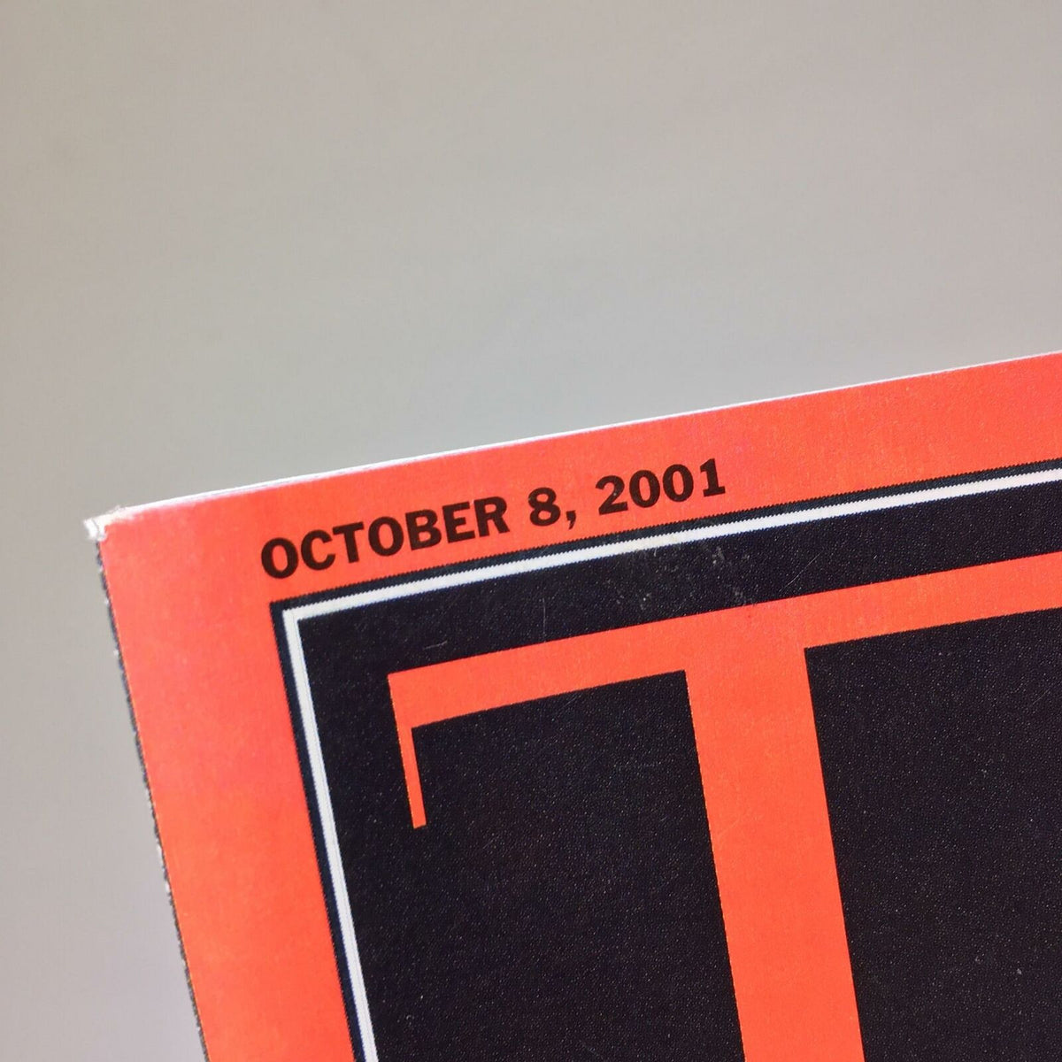Close-up of the date section on the Time Magazine from October 8, 2001, emphasizing its historical significance in discussing threats of germ and chemical warfare.