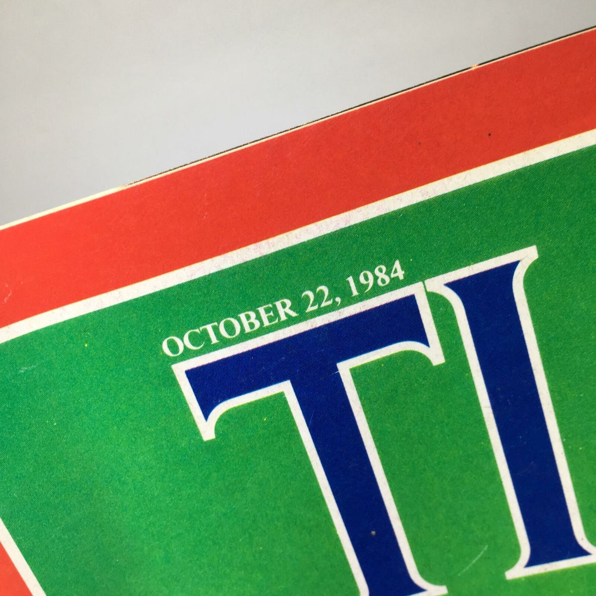 Close-up view of the date October 22, 1984, on the Time Magazine cover titled 'A Real Race?'. Arrow points to the publication date.