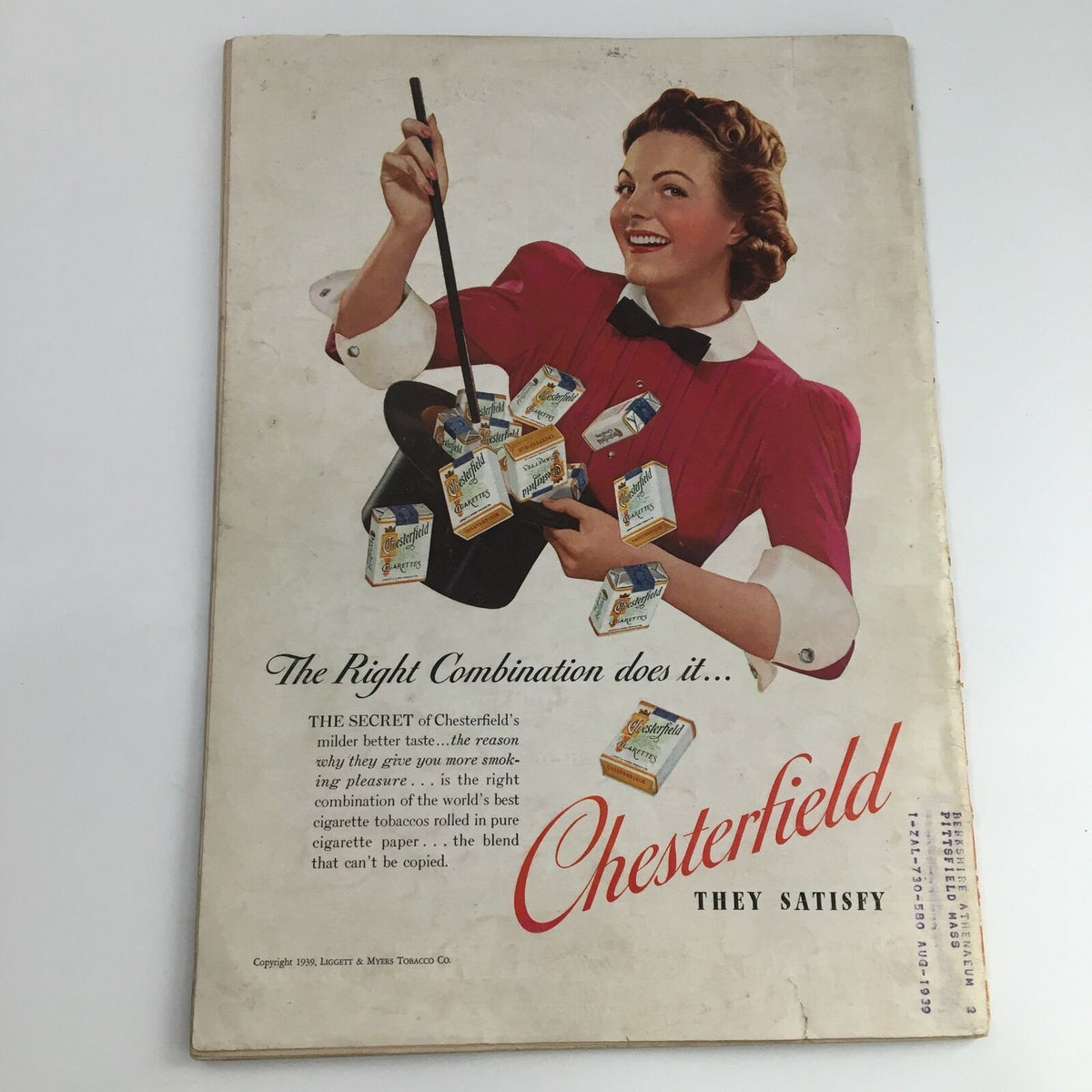 Chesterfield cigarette advertisement from Time Magazine April 3 1939, featuring a woman in a red dress promoting the product.