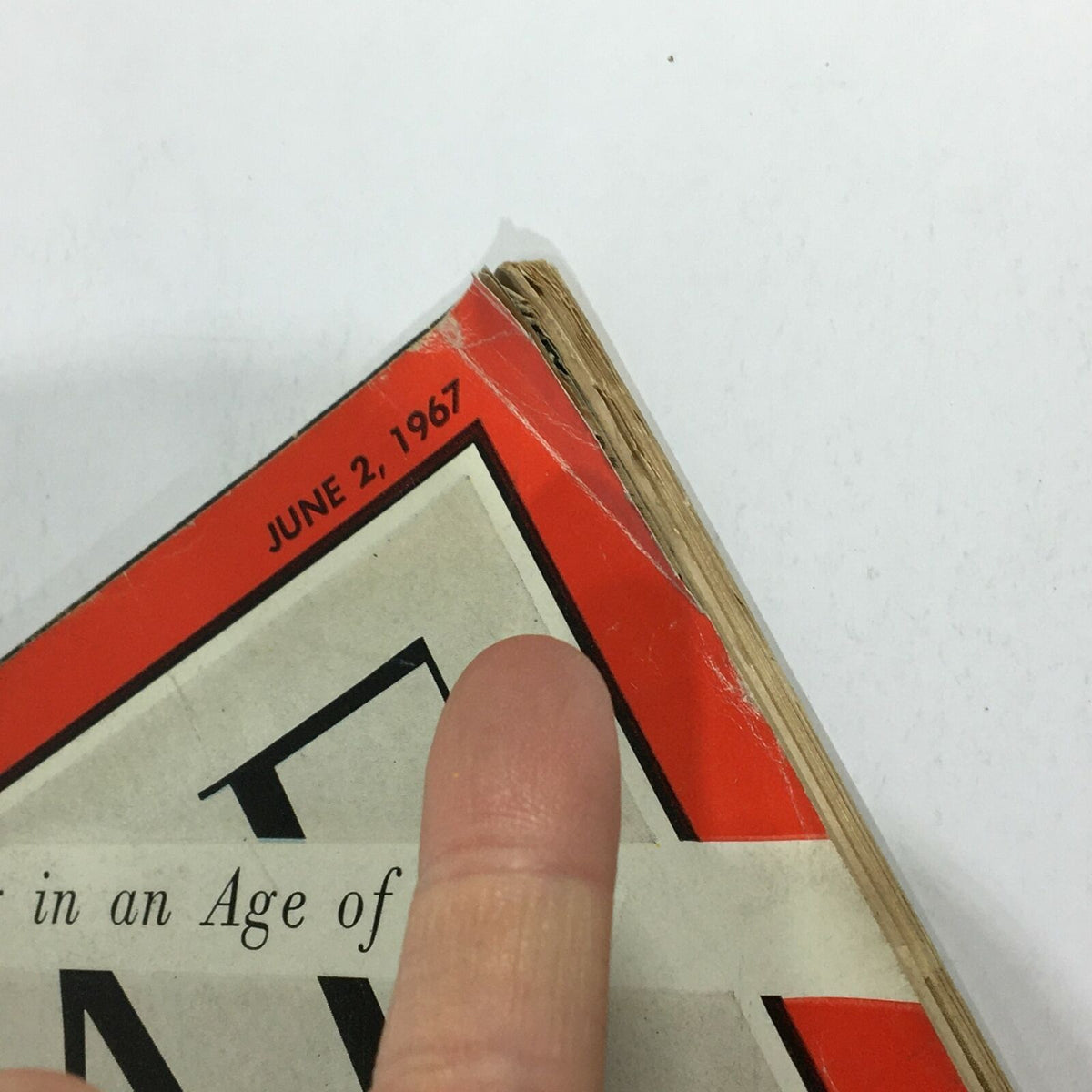 Close-up view of the corner of a vintage Time Magazine from June 2, 1967, showing the date and wear on the cover, highlighting the title 'VTG Time Magazine June 2 1967 - Robert Lowell / Poetry in an Age of Prose'.