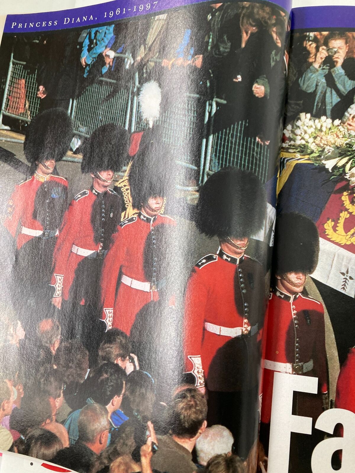 Page from Time Magazine September 15 1997 illustrating the funeral procession of Princess Diana, showcasing guards in traditional attire amidst a mourning crowd.