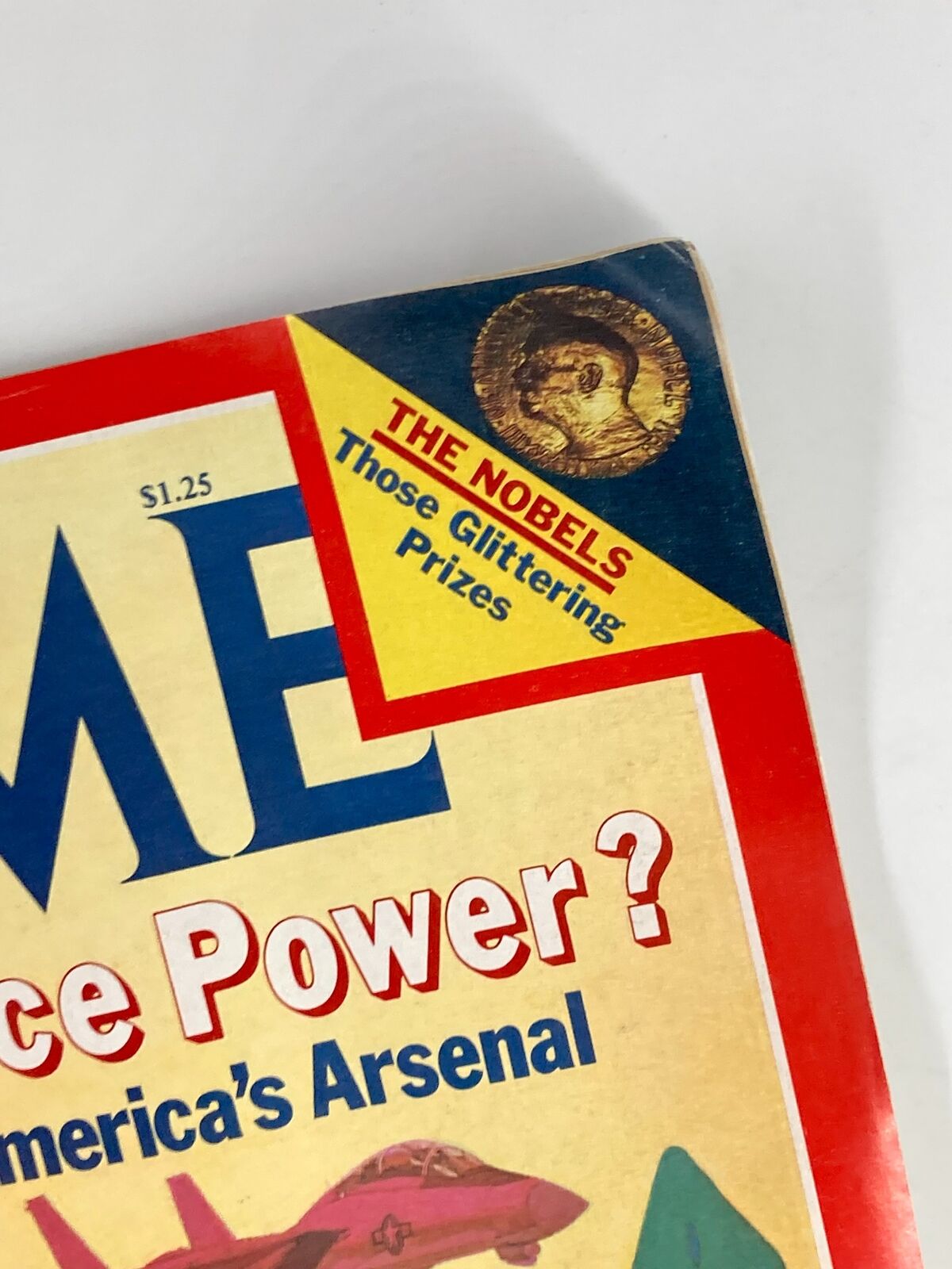 Close-up of the top corner of the Vintage Time Magazine from October 29, 1979, highlighting the feature on the Nobel Prizes along with the cover title, 'What Price Power? Expanding America's Arsenal'.