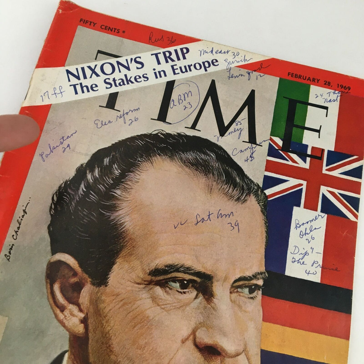 Close-up of Time Magazine February 28, 1969 cover, showcasing Richard Nixon's portrait and the headline 'Nixon's Trip - The Stakes in Europe' with additional handwritten notes.