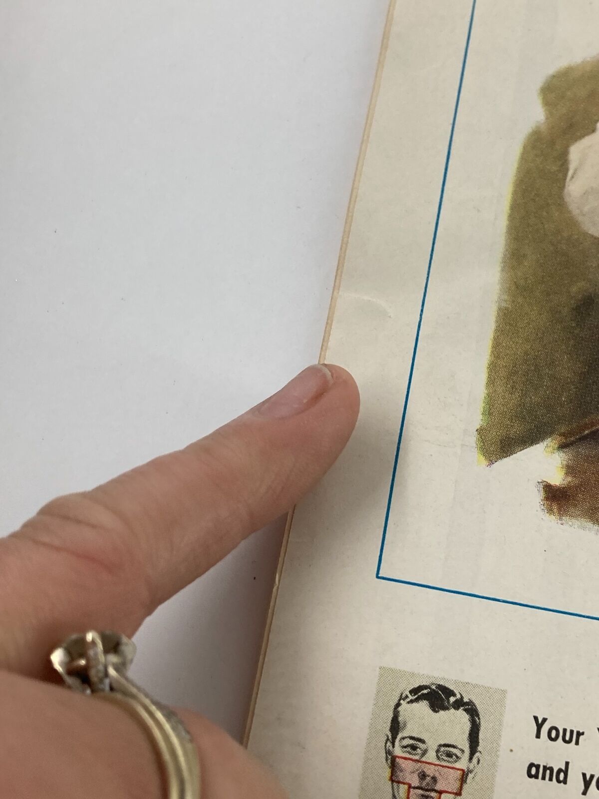 Close-up of the edge of a vintage magazine page from Time Magazine June 25 1945, showing minor wear and condition details. This section is part of the issue featuring Lieut. General Lucius D. Clay.