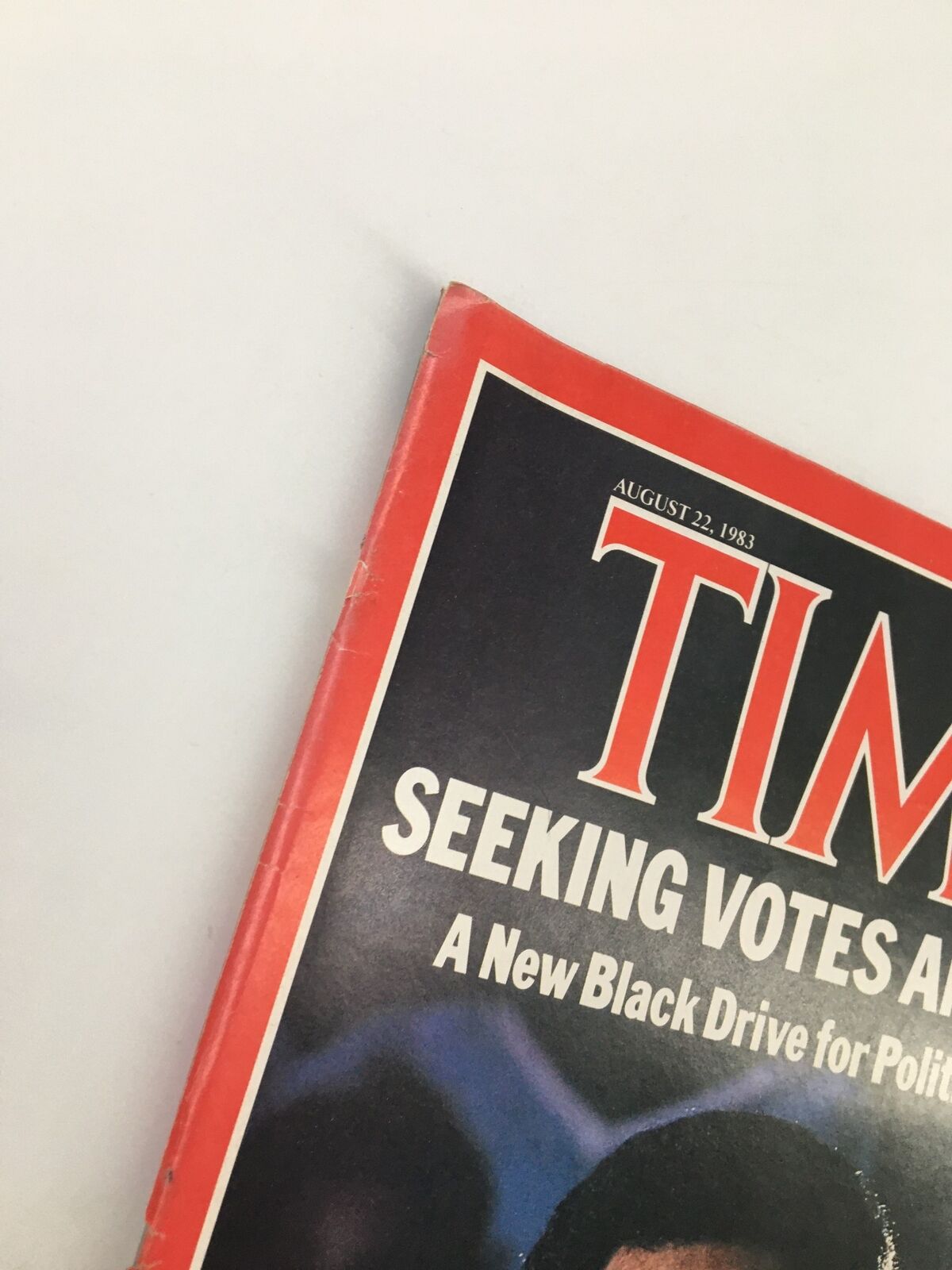Close-up view of the top corner of the VTG Time Magazine August 22 1983 featuring Jesse Jackson's cover, showcasing wear consistent with vintage publications.