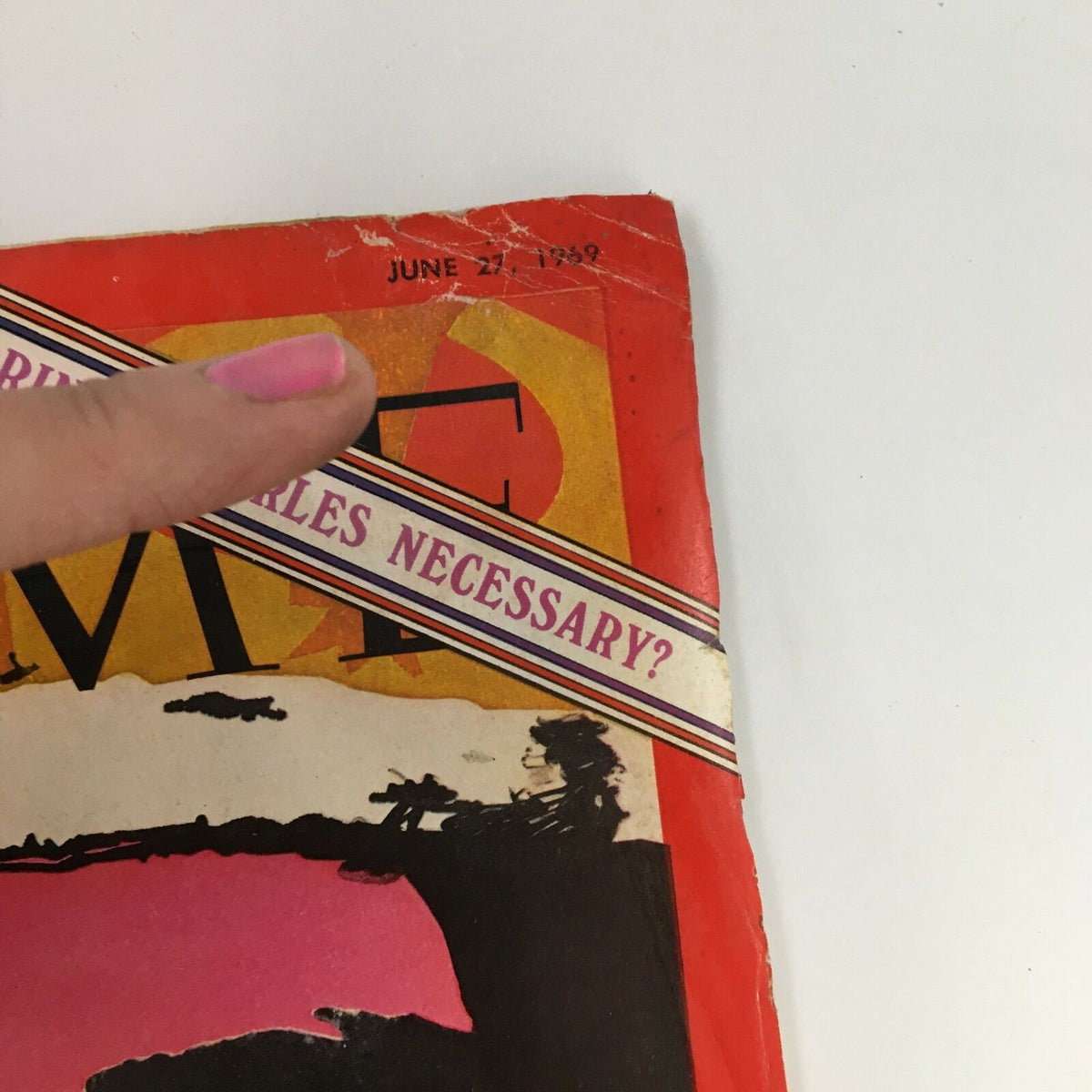 Close-up of Time Magazine from June 27, 1969, featuring the title and date at the top, highlighting its vintage condition and wear.