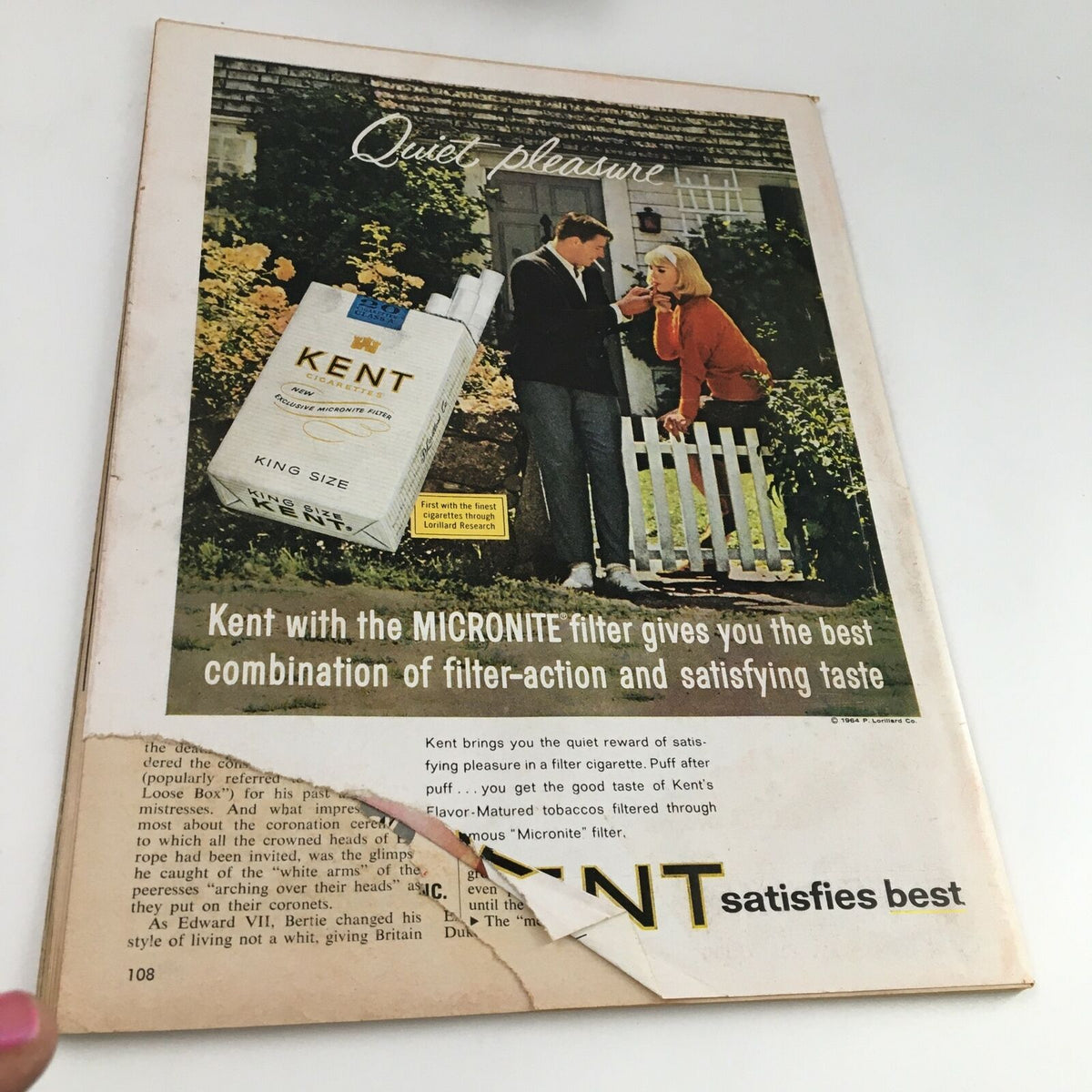 Inside page of Time Magazine May 22, 1964 displaying an advertisement for Kent cigarettes, illustrating a couple in a garden.