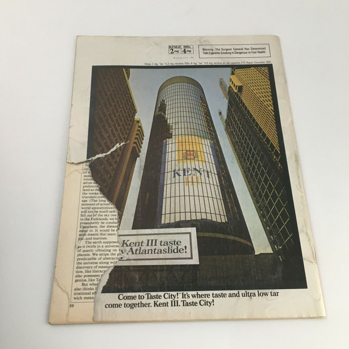 Alternate view of the back cover of the vintage Time Magazine from April 19, 1982, highlighting the advertisement for Kent cigarettes with visible wear and tears.