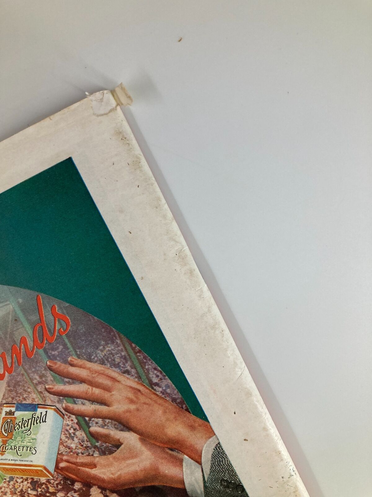 Detail of the back cover of the vintage Time Magazine from August 23, 1937, showcasing the Chesterfield advertisement and signs of age.