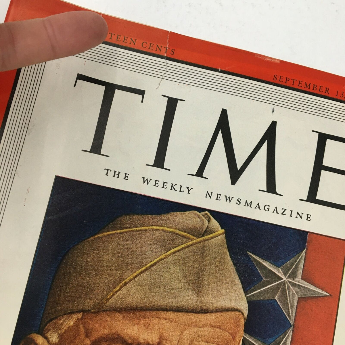 Close-up of the Time Magazine cover from September 13, 1943, showing the title and a crease near the top, highlighting the historical significance of General Dwight D. Eisenhower's journey.