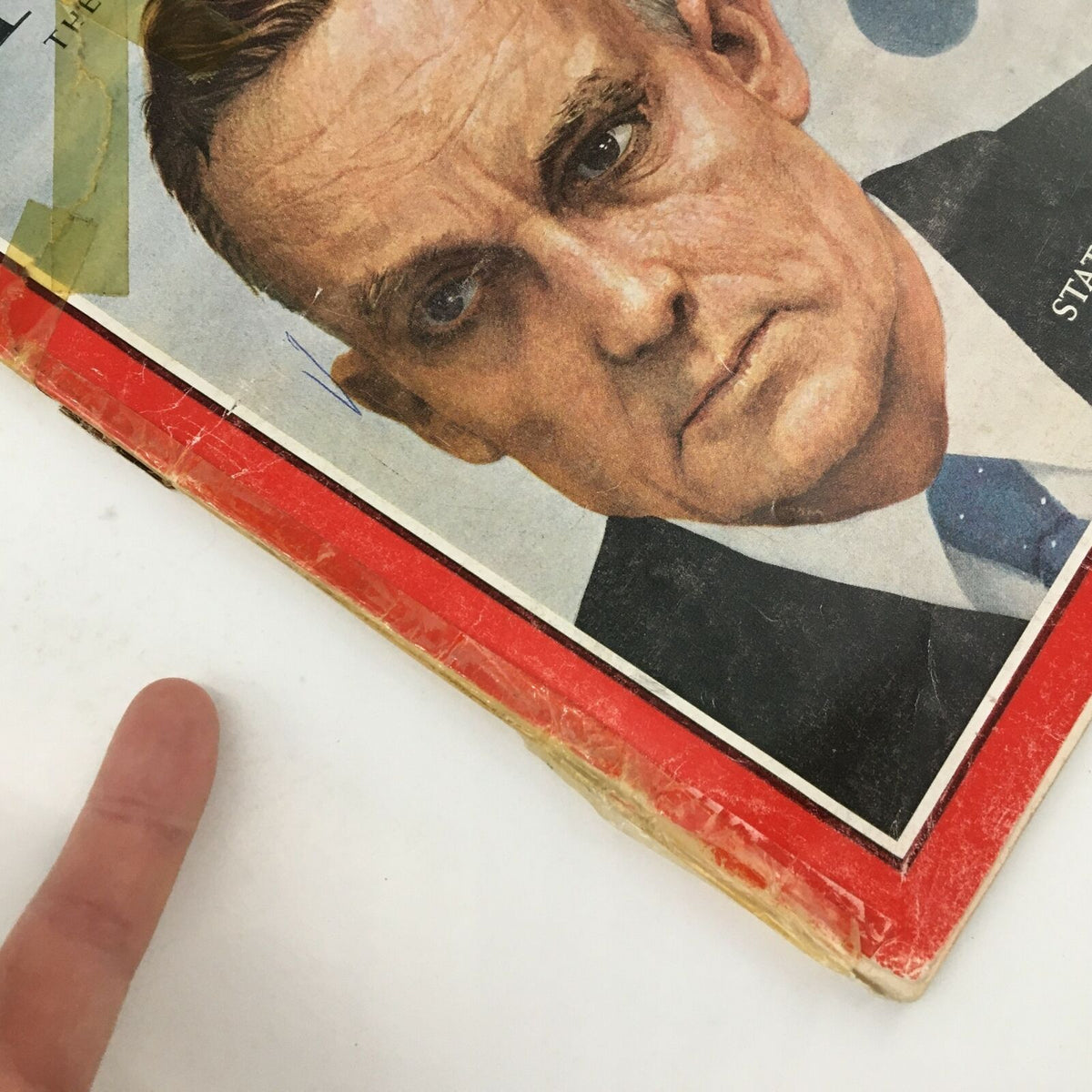 Detailed view of the cover of Time Magazine January 31, 1964, focusing on the facial expression of State Department's Thomas Mann.