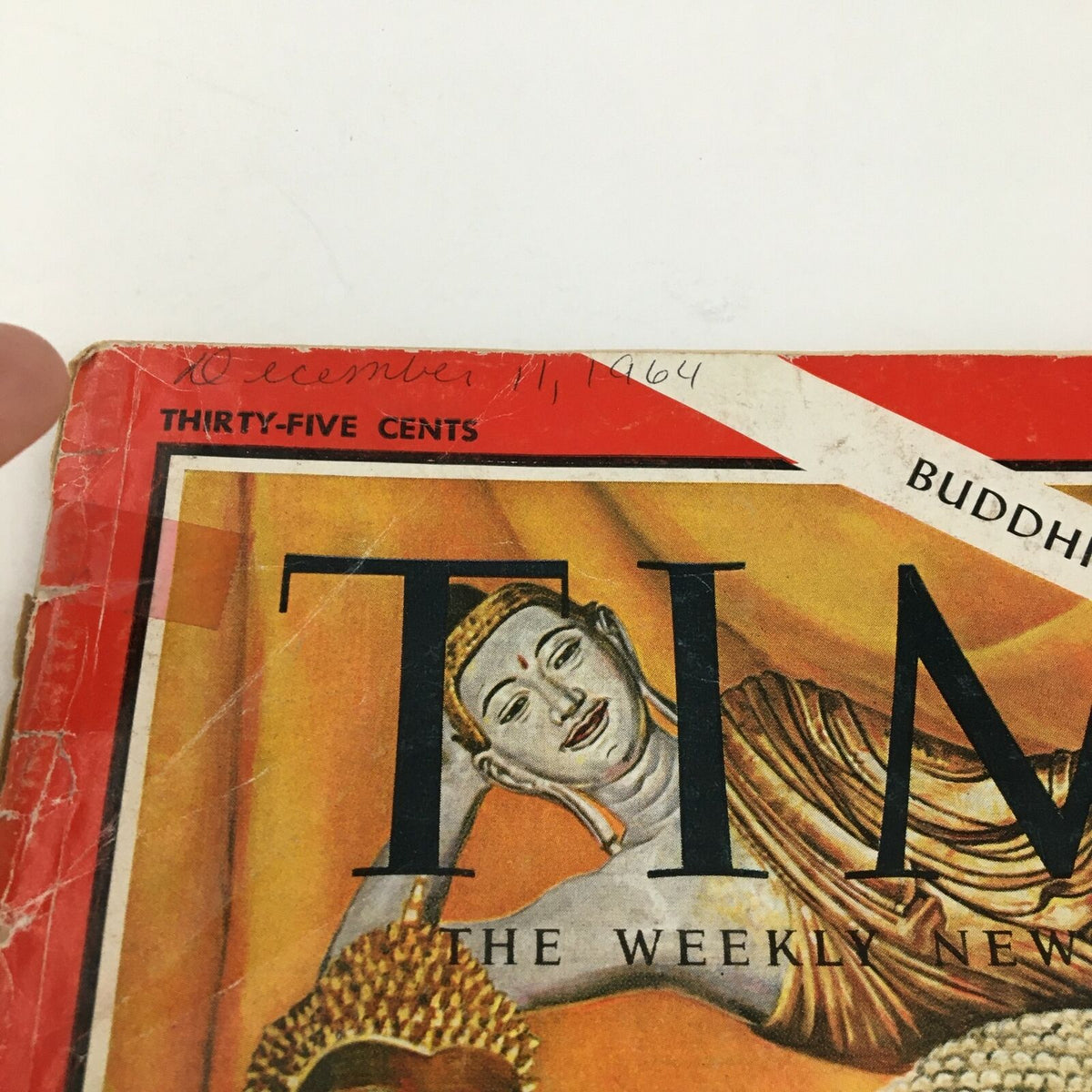 Cover of Time Magazine December 11, 1964 featuring a depiction of Buddha, highlighting the themes of Buddhism, religion, and politics.