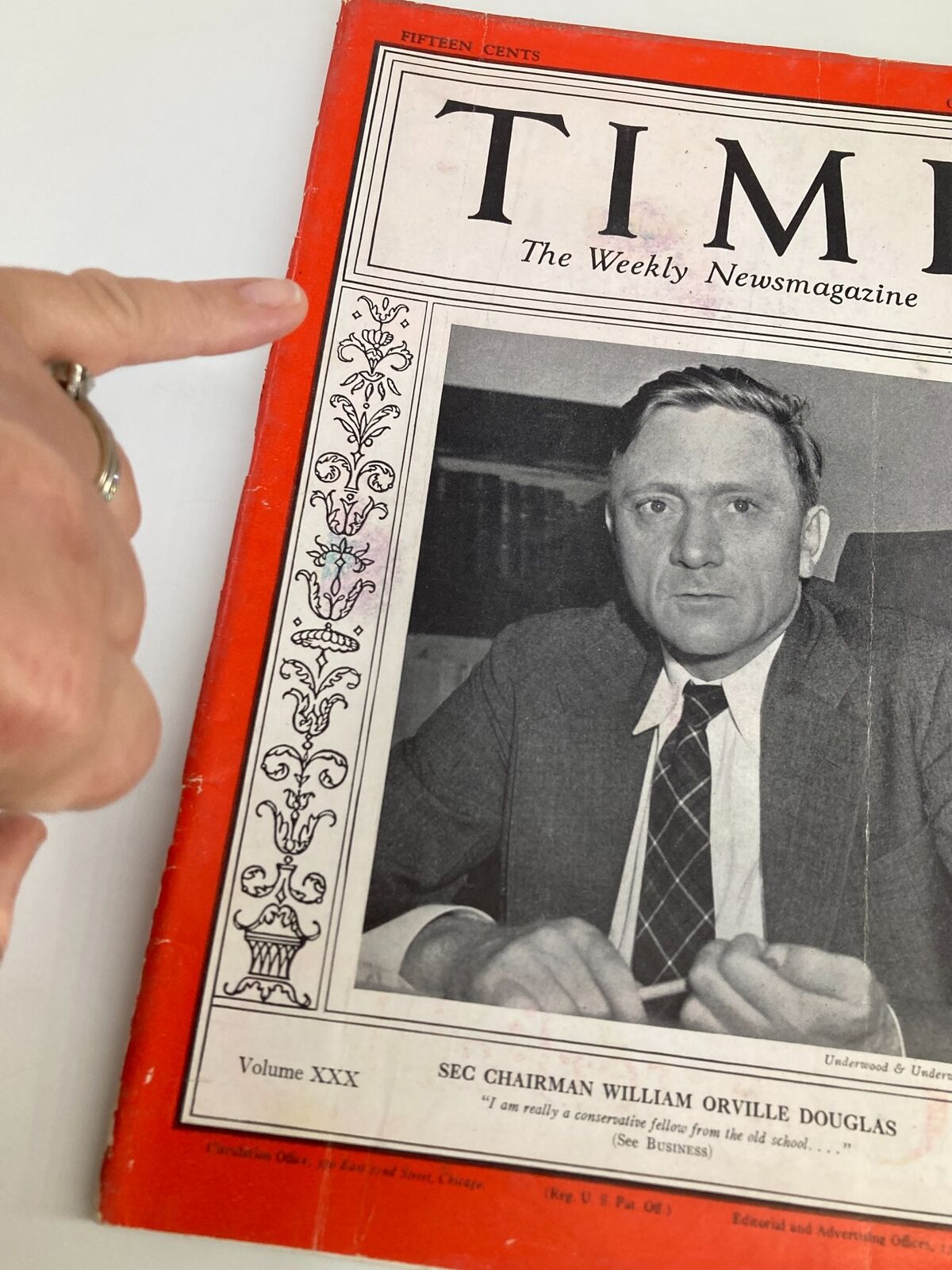 Close-up of the vintage Time Magazine from October 11, 1937 highlighting the cover photo of William Orville Douglas and the magazine details.