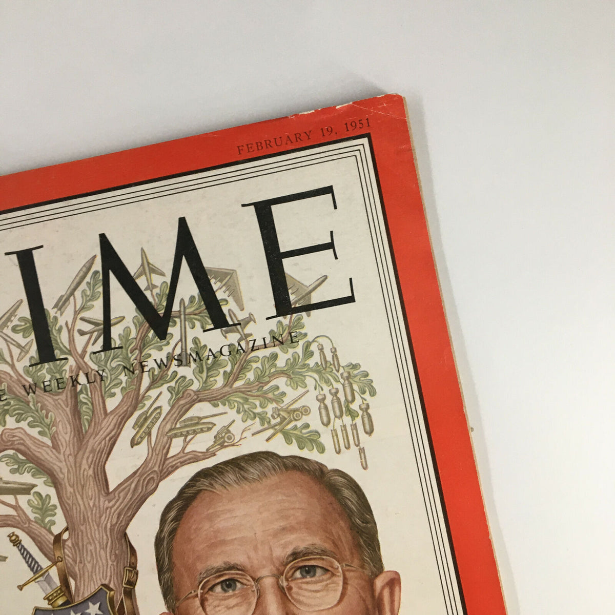 Close-up view of the upper section of the VTG Time Magazine Cover from February 19, 1951, highlighting the title 'TIME' and the release date alongside artwork of Mobilizer Charles E. Wilson.