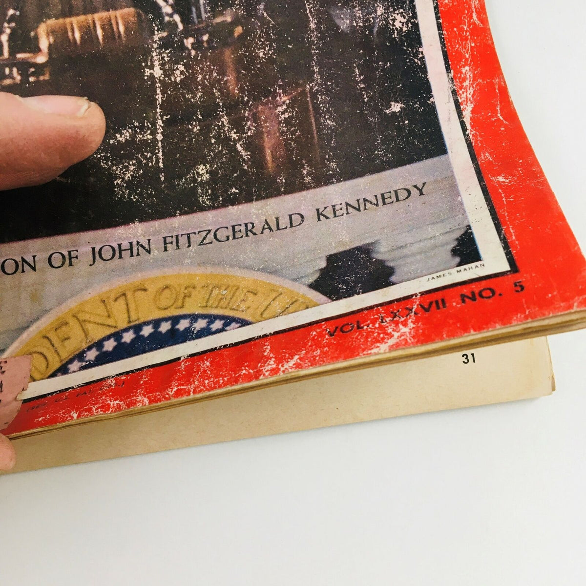 Close-up view of the spine and lower section of Time Magazine January 27, 1961, highlighting its original volume and number details related to the Inauguration of John F. Kennedy.
