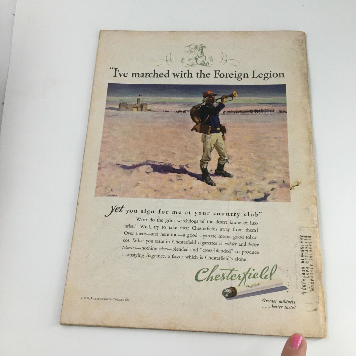 Vintage advertisement featuring a soldier with a trumpet titled 'I've marched with the Foreign Legion,' from Chesterfield cigarettes, promoting their unique flavor and mildness, adding historical context to the Time Magazine May 18, 1931, Vol 17 #20.