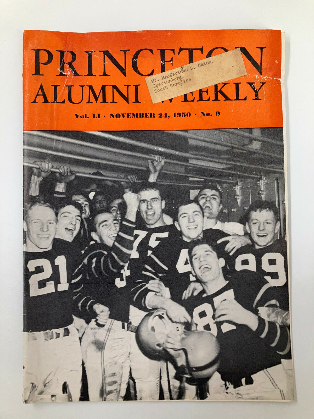 VTG Princeton Alumni Weekly November 24 1950 cover featuring a group of jubilant Princeton football players celebrating a victory, showcasing the school's spirit and camaraderie.