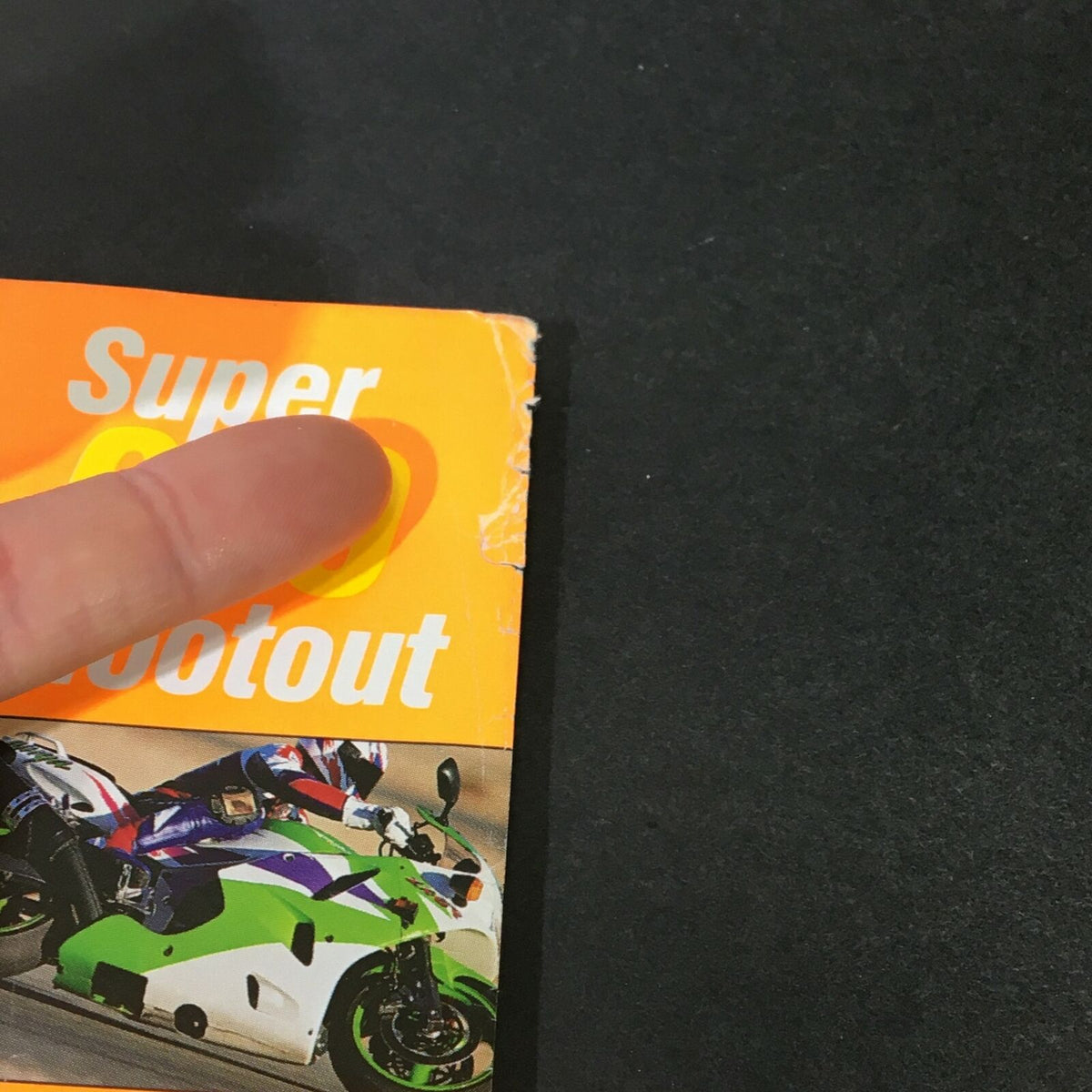 Close-up of the 'Super 600 Shootout' section on the cover of Cycle World Magazine April 1995, highlighting the motorcycle comparison feature.