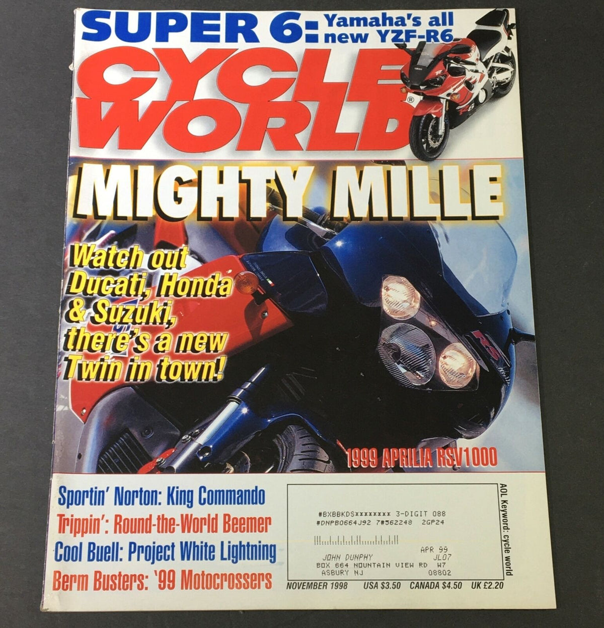Cycle World Magazine cover from November 1998 featuring the Yamaha YZF-R6 and 1999 Aprilia RSV1000 with headline 'Mighty Mille'. The cover highlights the competitive landscape of Ducati, Honda, and Suzuki in the motorcycle market.