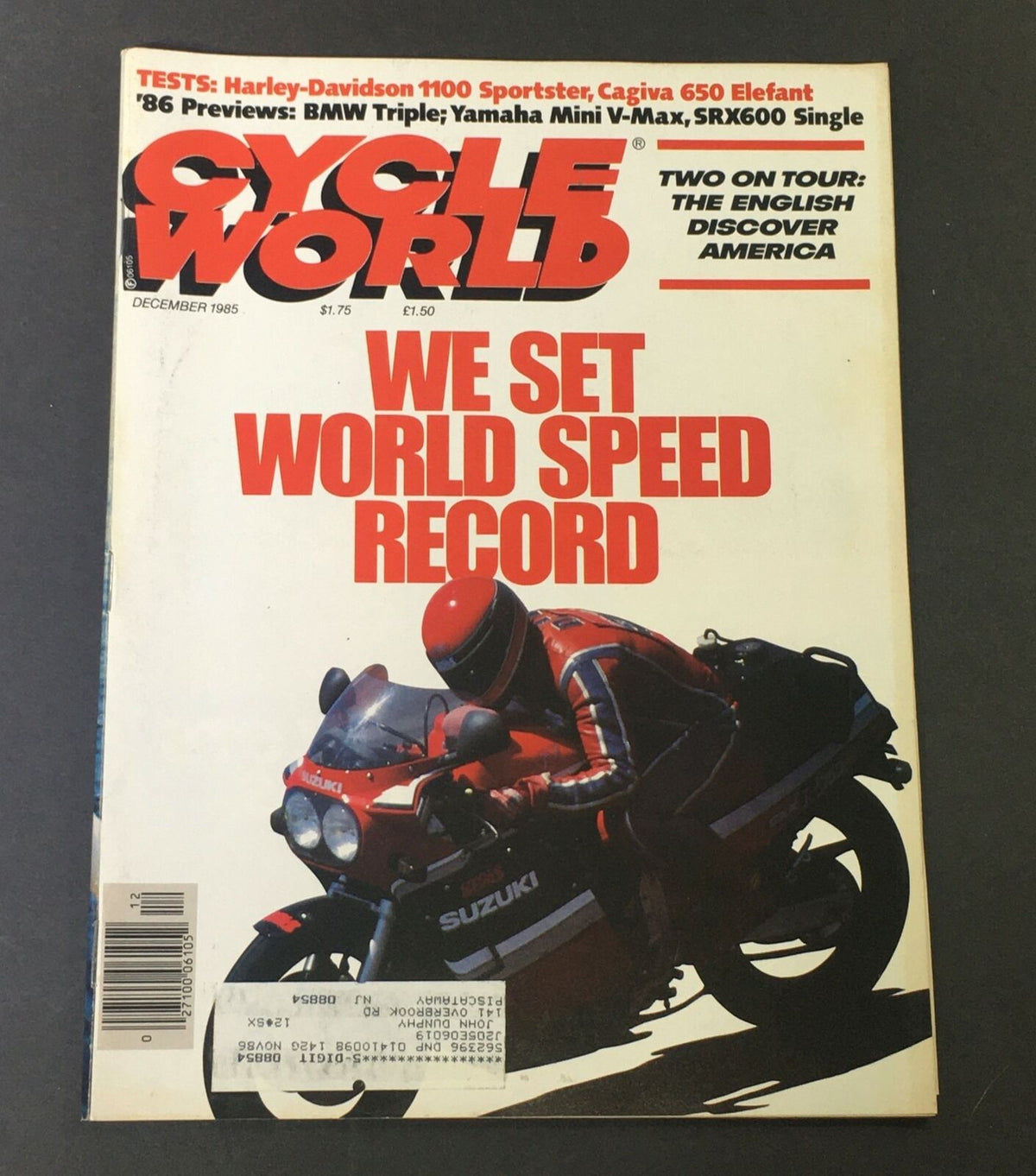 Cover of VTG Cycle World Magazine December 1985 featuring a Suzuki motorcycle and a headline about setting a world speed record, along with a feature on the Harley-Davidson 1100 Sportster test.