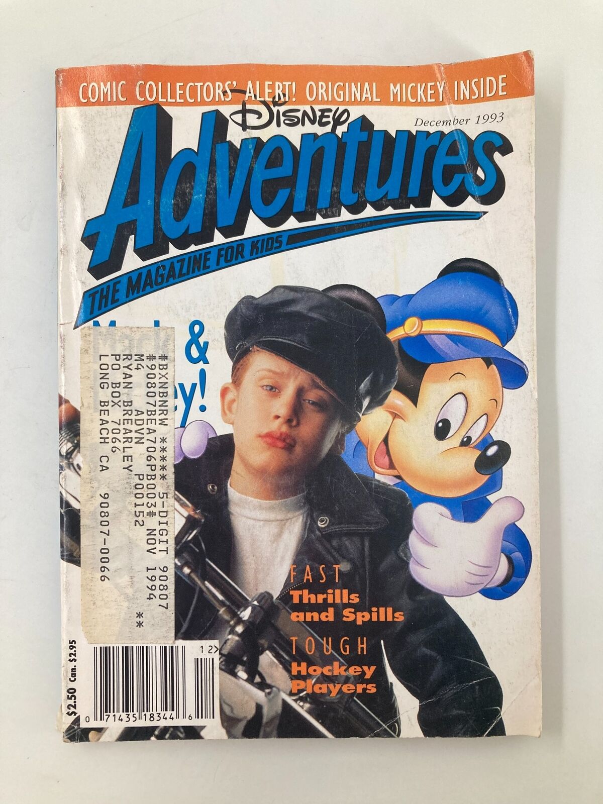 Cover of Disney Adventures Magazine December 1993 featuring Macaulay Culkin and Mickey Mouse. The magazine includes a collector's alert and features exciting topics for kids.
