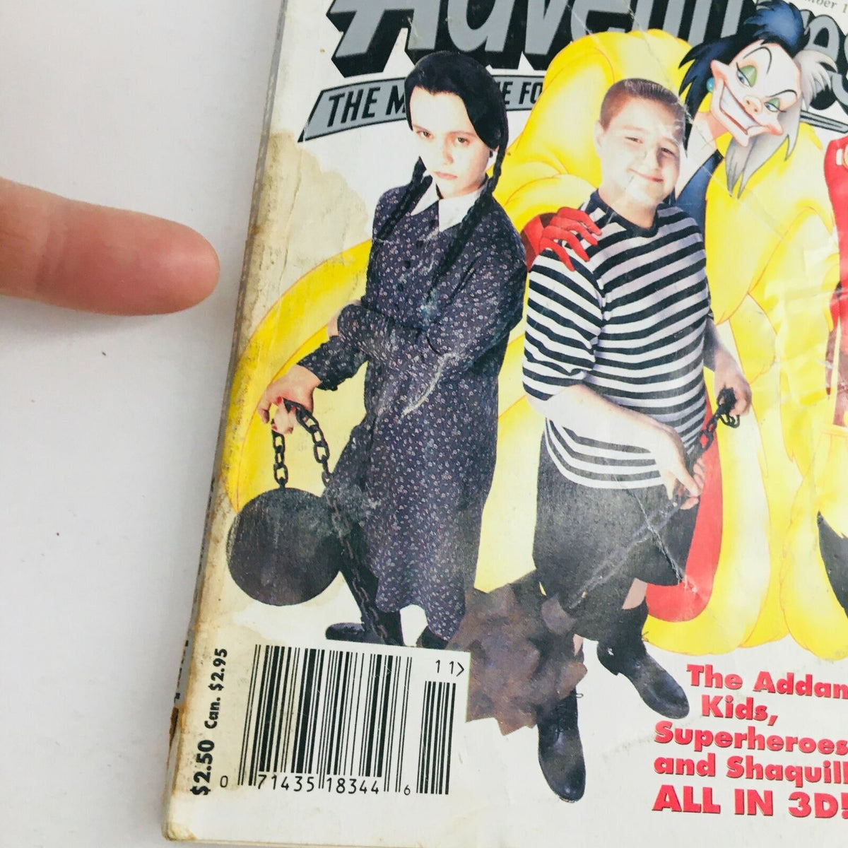 Close-up view of the Disney Adventures Magazine November 1993 cover featuring The Addams Kids and Cruella de Vil, showcasing vintage Disney art and collectible magazine details.