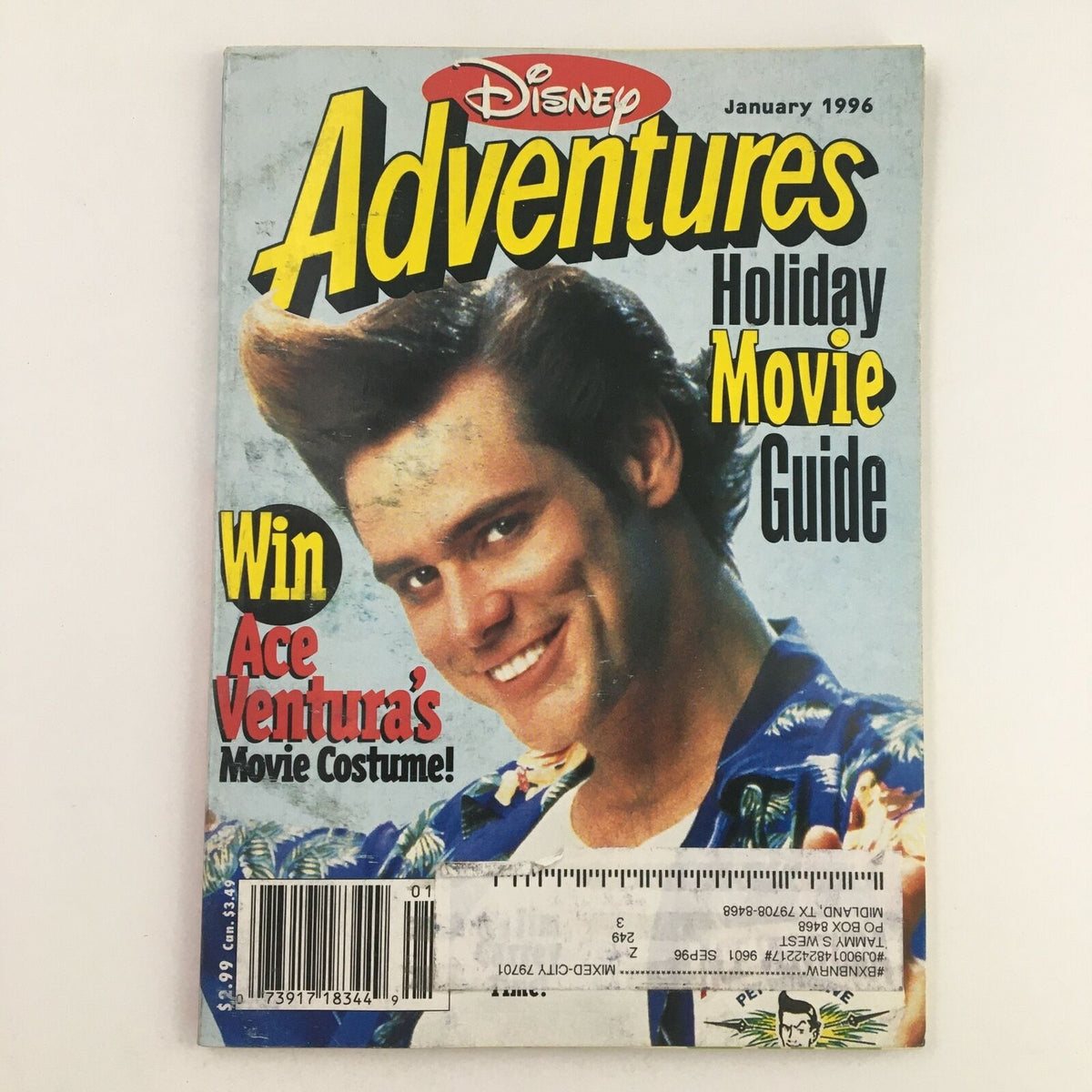 Disney Adventures Magazine January 1996 featuring Jim Carrey as Ace Ventura on the cover. The magazine highlights a holiday movie guide and includes a promotion to win Ace Ventura's movie costume.