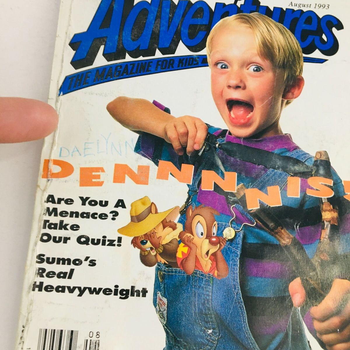 Close-up of the cover of Disney Adventures Magazine, August 1993 showcasing Dennis the Menace. The magazine includes playful elements alongside Chip & Dale and engaging text inviting readers to take a quiz.