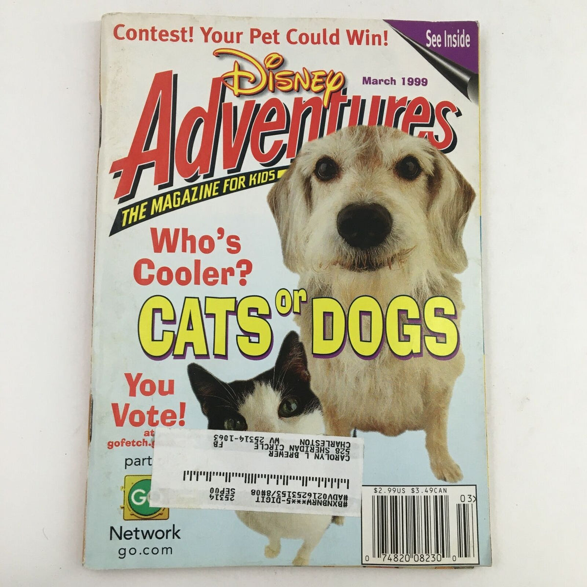 Cover of Disney Adventures The Magazine for Kids March 1999 featuring a debate on who's cooler, cats or dogs, with an illustration of a dog and a cat, colorful title and promotional text.