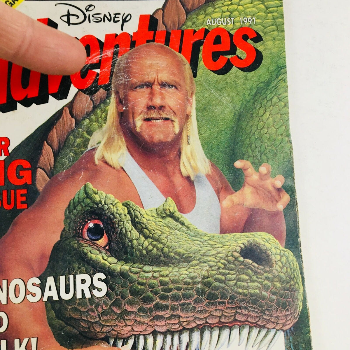 Cover of Disney Adventures Magazine August 1991 featuring Hulk Hogan and a dinosaur, reflecting nostalgic pop culture of the early 1990s.