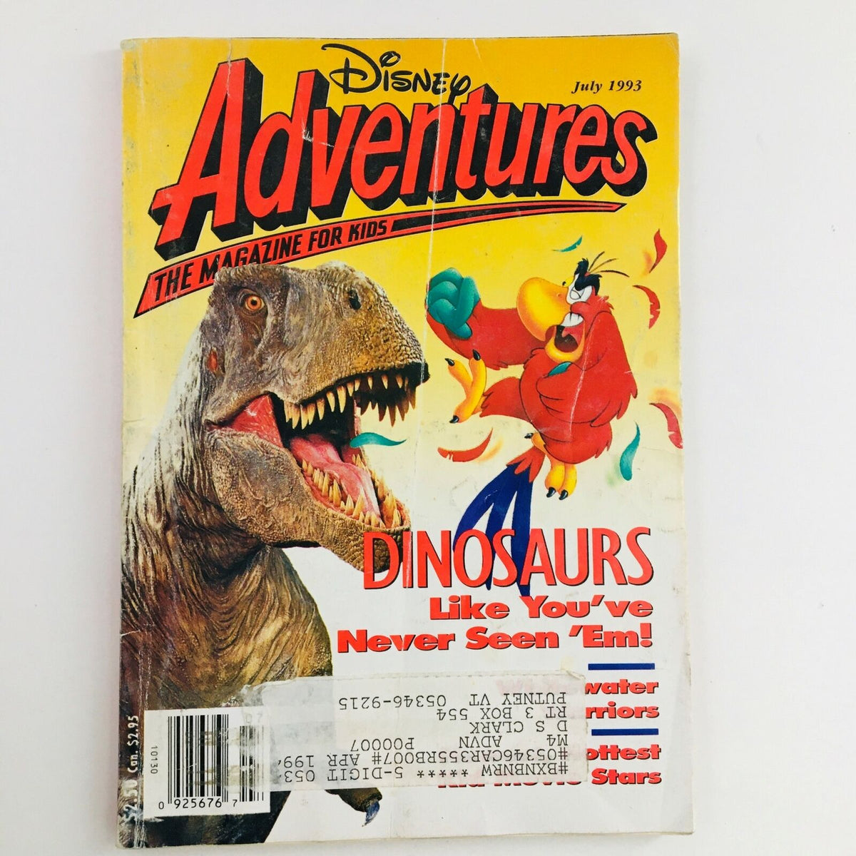 Cover of Disney Adventures Magazine, July 1993 edition, featuring the headline 'Dinosaurs Like You've Never Seen 'Em!' The cover depicts a roaring dinosaur alongside a colorful parrot character, inviting kids to explore exciting dinosaur adventures.