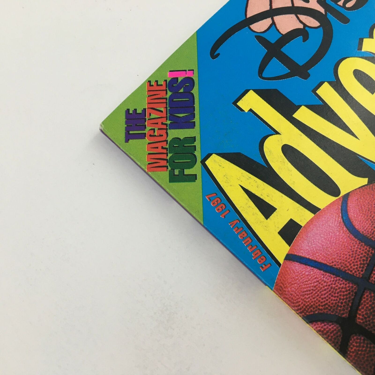 Close-up of the top of Disney Adventures Magazine February 1997 highlighting the phrase 'The magazine for kids!' with a colorful design.