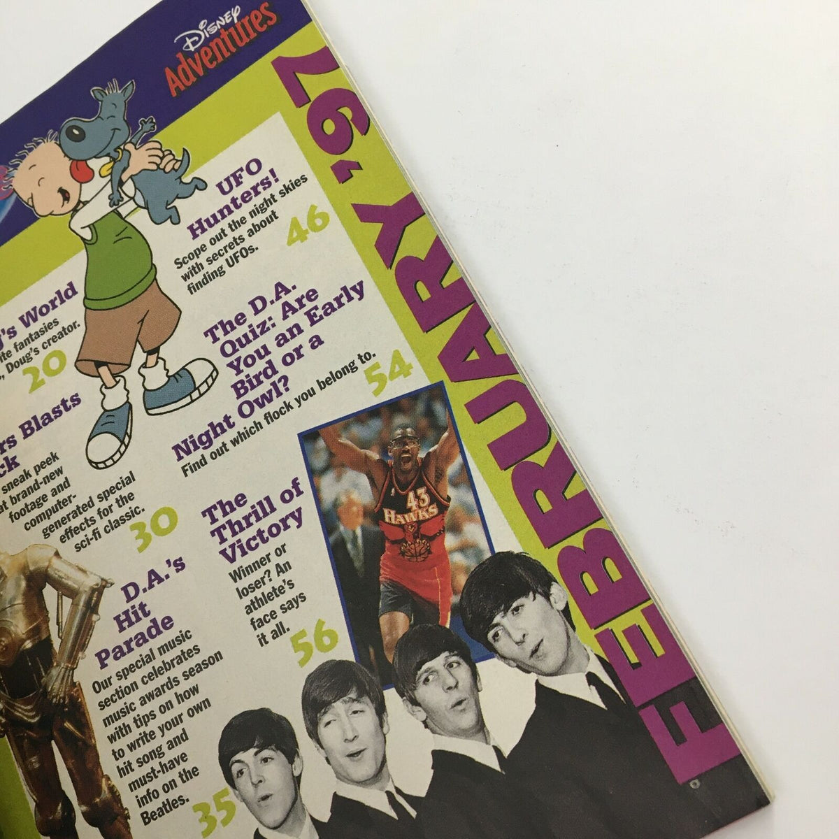Inside page of Disney Adventures Magazine February 1997 displaying the table of contents, featuring segments about Doug, UFO Hunters, and D.A.'s Hit Parade.