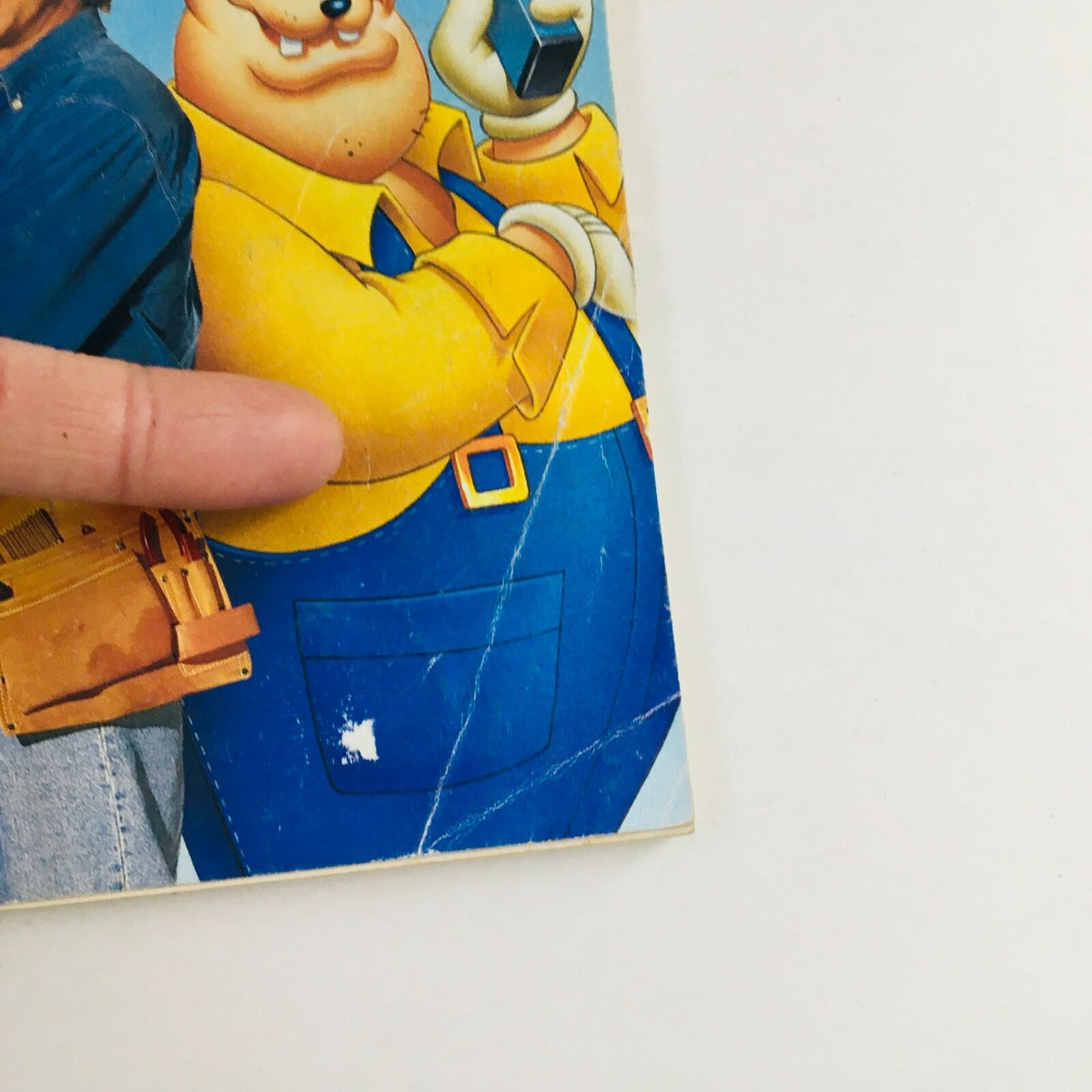 Close-up of the cover of Disney Adventures Magazine March 1993, showing minor wear and detailing, including Tim Allen and a cartoon character.