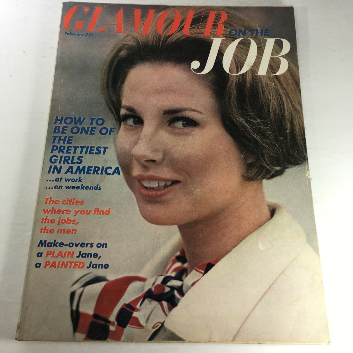 Cover of VTG Glamour On The Job Magazine from February 1966 featuring a stylish woman with a bob hairstyle, promoting beauty tips and job insights for women in the workplace.