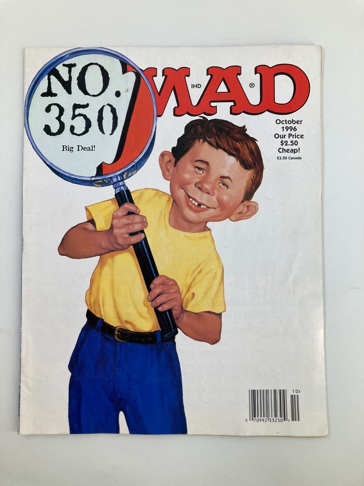 Mad Magazine October 1996 No. 350 cover featuring a humorous illustration of a young boy holding a magnifying glass with the text 'Big Deal!' highlighting the iconic issue's playful style.