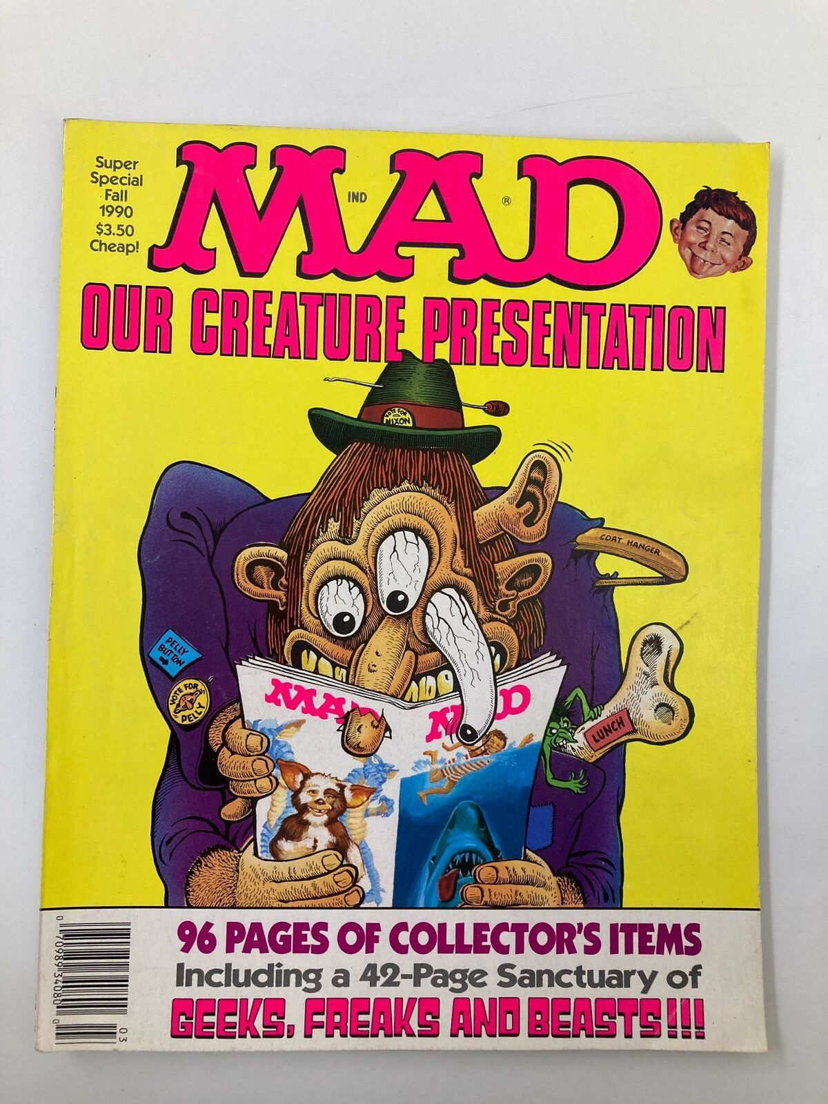 Cover of Mad Magazine Fall 1990 issue titled 'Our Creature Presentation', featuring a colorful illustration of a quirky character reading the magazine. The vibrant yellow background highlights the humorous theme, showcasing features like '96 Pages of Collector's Items' and a '42-Page Sanctuary of Geeks, Freaks, and Beasts!'