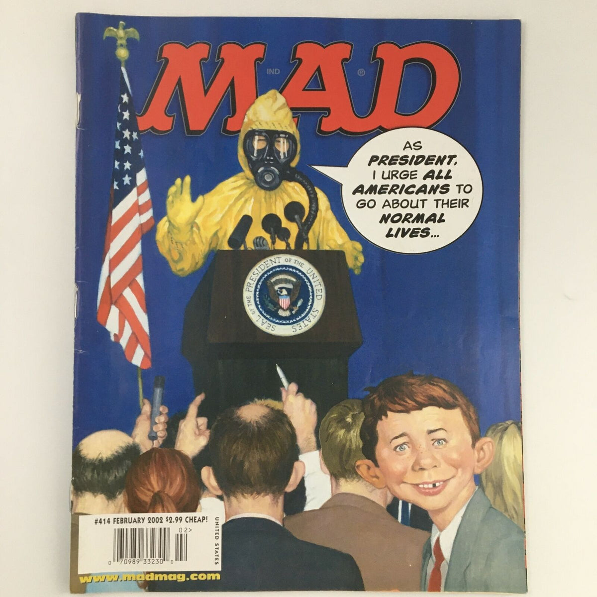 Mad Magazine February 2002 #414 cover featuring George W. Bush in a hazmat suit, delivering a speech at a podium with an American flag in the background, highlighting political satire and humor.