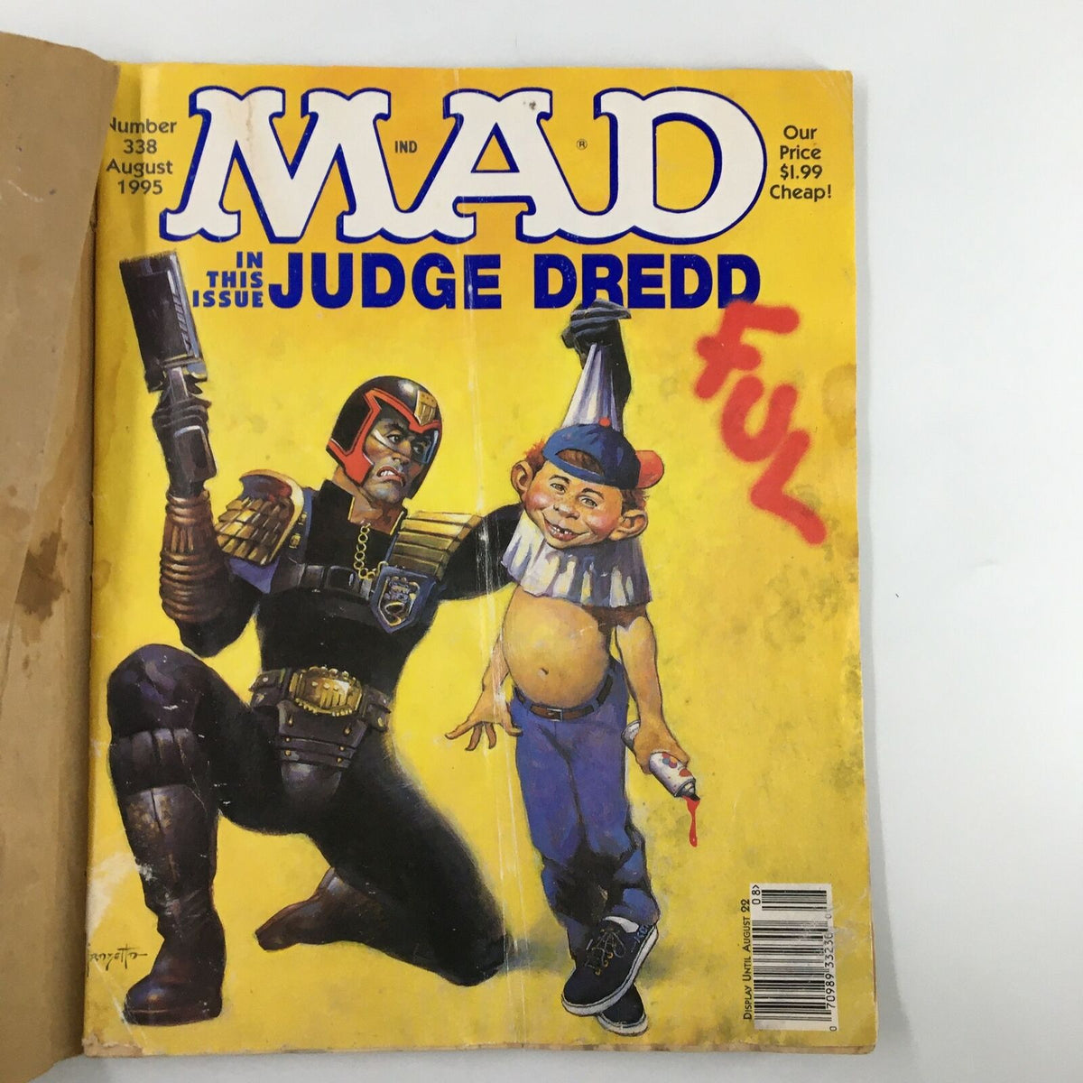 Cover of Mad Magazine August 1995, Issue No. 338 featuring Judge Dredd, showcasing the iconic art style and humor characteristic of the magazine, rated Very Good (4.0).