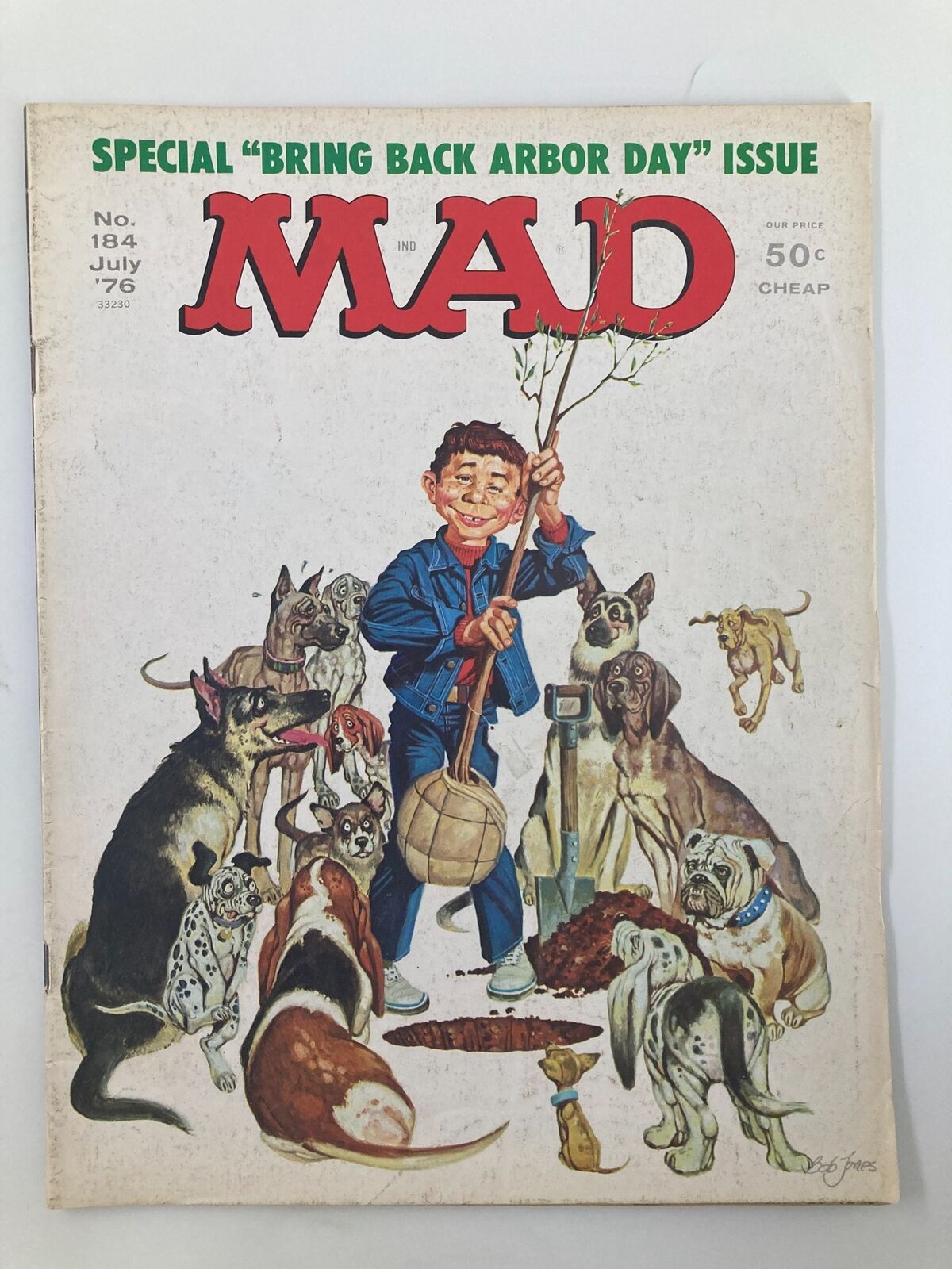 Cover of Mad Magazine July 1976 No. 184 featuring the title 'Bring Back Arbor Day'. The illustration shows a smiling boy holding a tree branch surrounded by various playful dogs in a humorous setting.