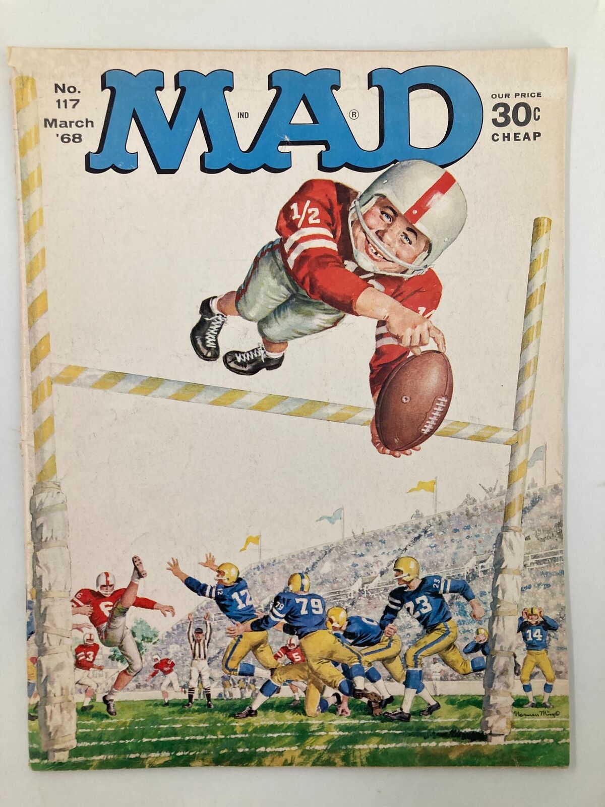 Cover of Mad Magazine March 1968 No. 117 featuring a humorous football scene, depicting a child in a football uniform jumping to catch a ball, surrounded by players and a cheering crowd.