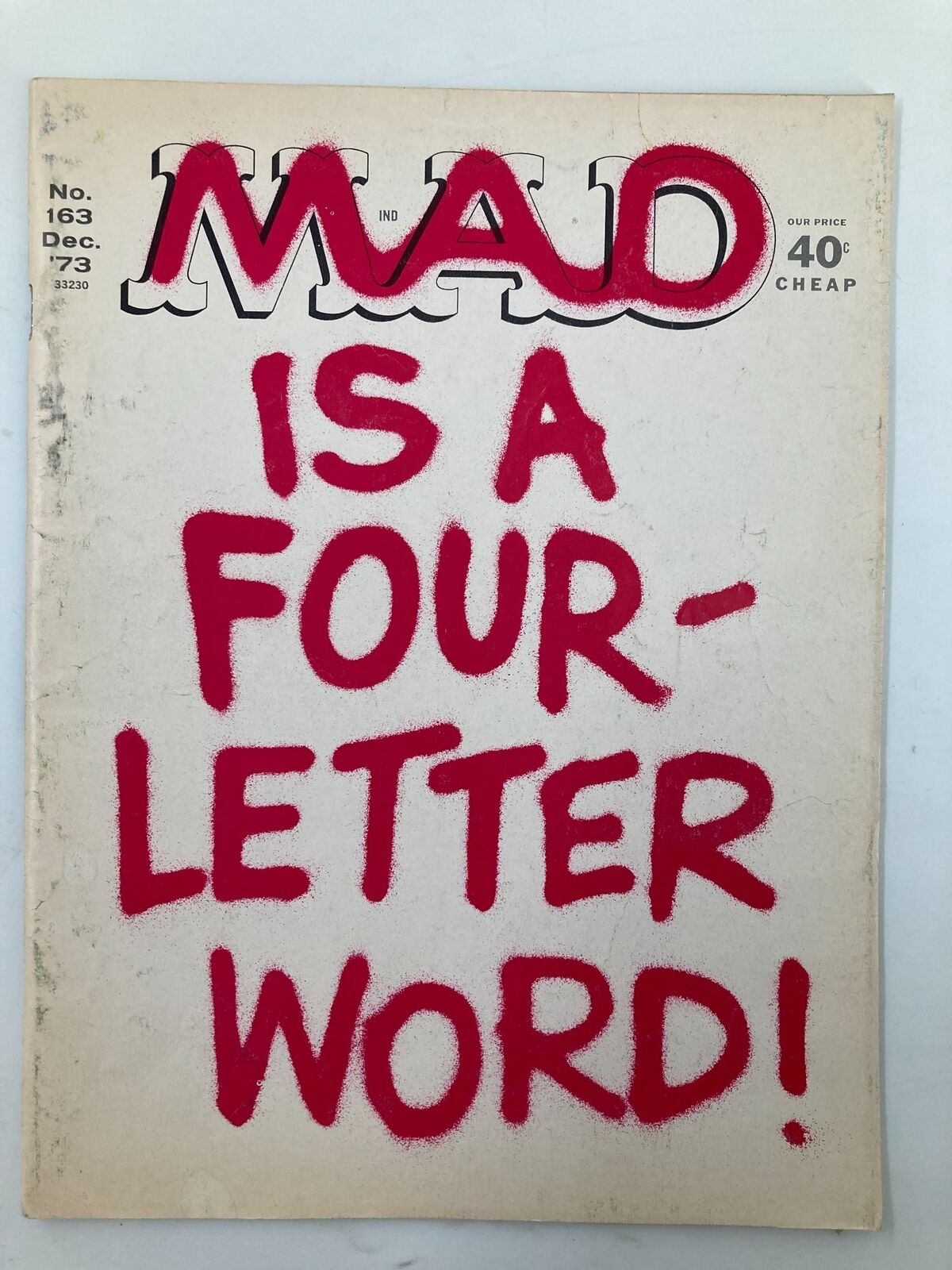 Cover of Mad Magazine December 1973 No. 163, featuring bold red text stating 'MAD IS A FOUR-LETTER WORD!' Suitable for collectors of vintage magazines.