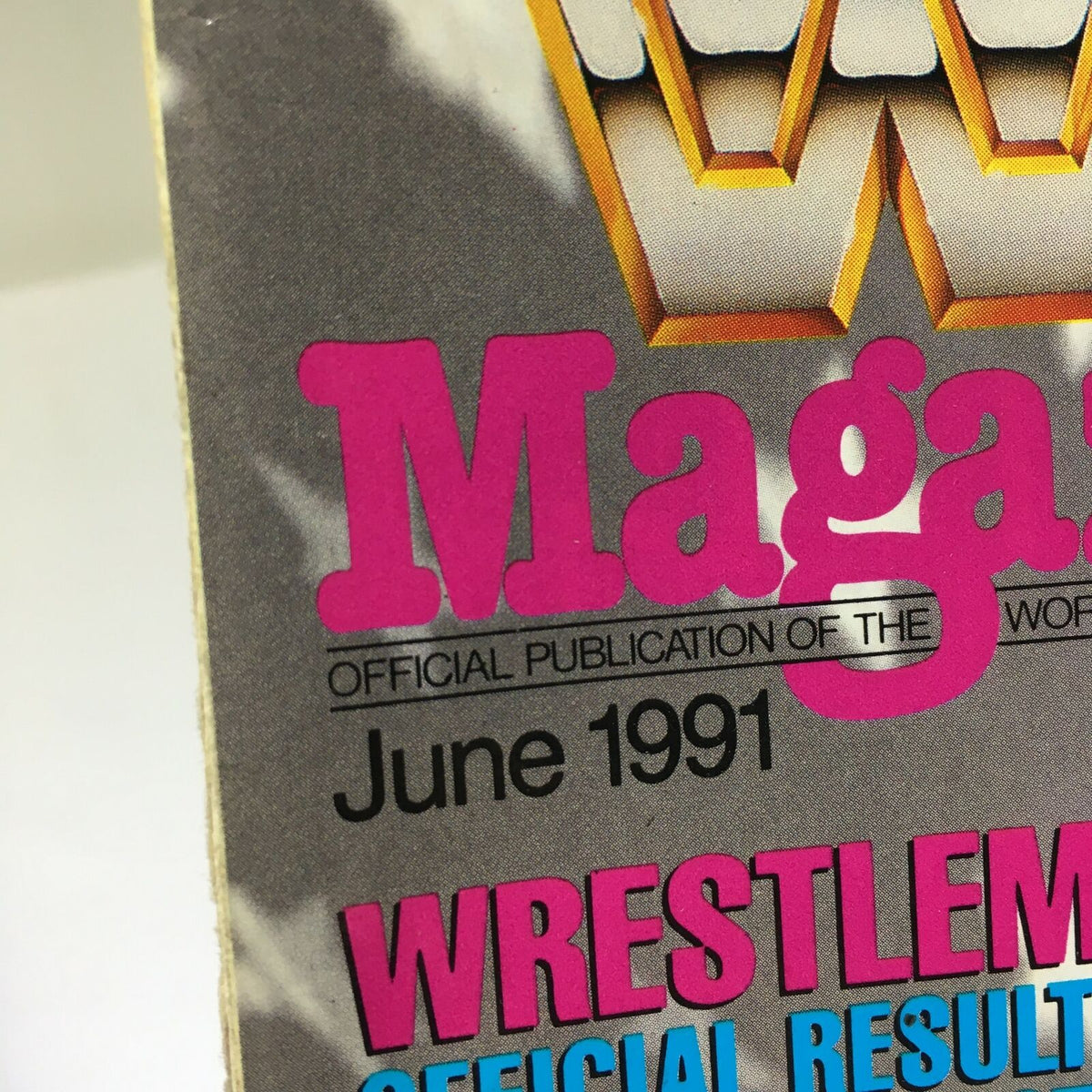 WWF Magazine: Wrestle Mania VII - Ultimate Warrior - June 1991, close-up of the magazine title and release date highlighting its status as the official publication of the World Wrestling Federation.