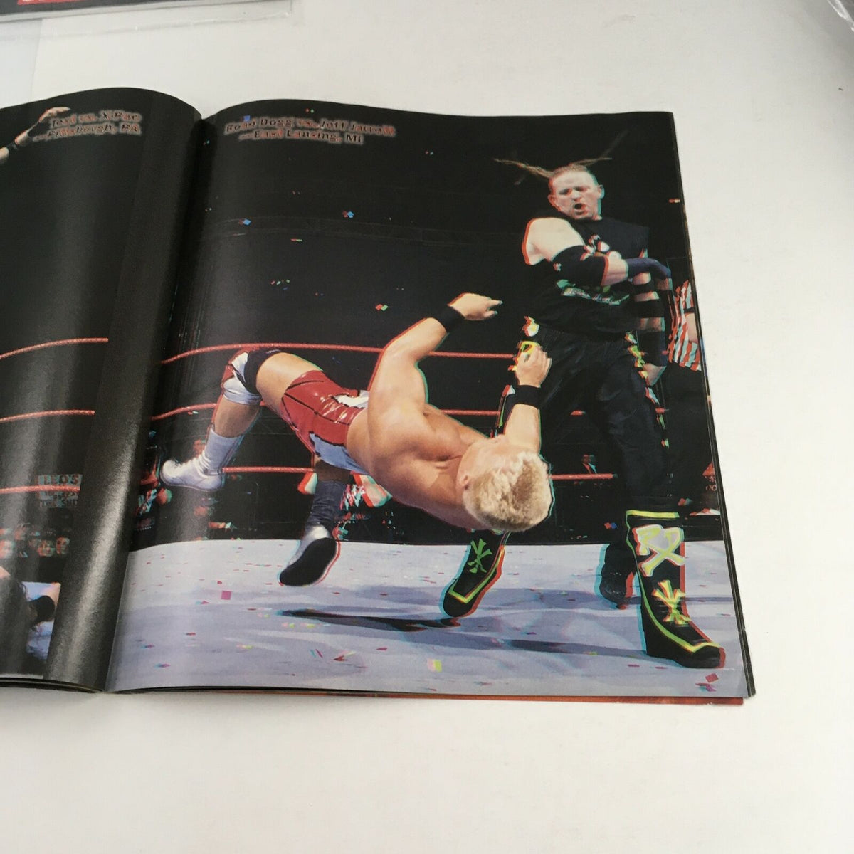 WWF Magazine February 2000 Best of '99 in 3-D, capturing another dynamic moment from a wrestling match with vibrant 3D visuals.